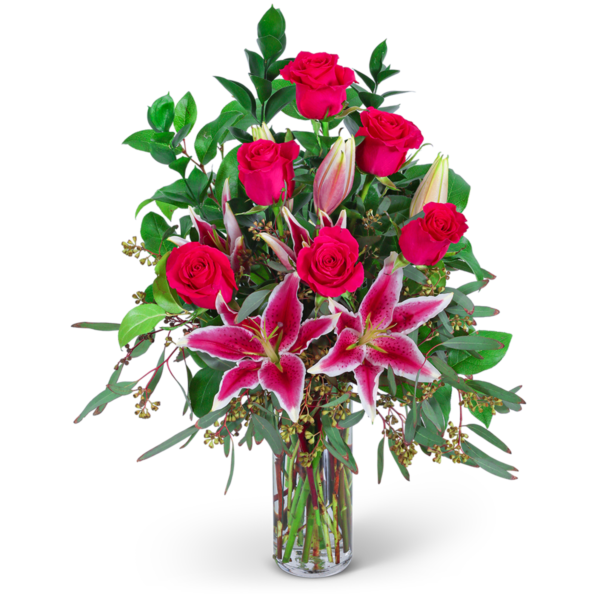 Pink roses and lilies arranged in a clear glass vase