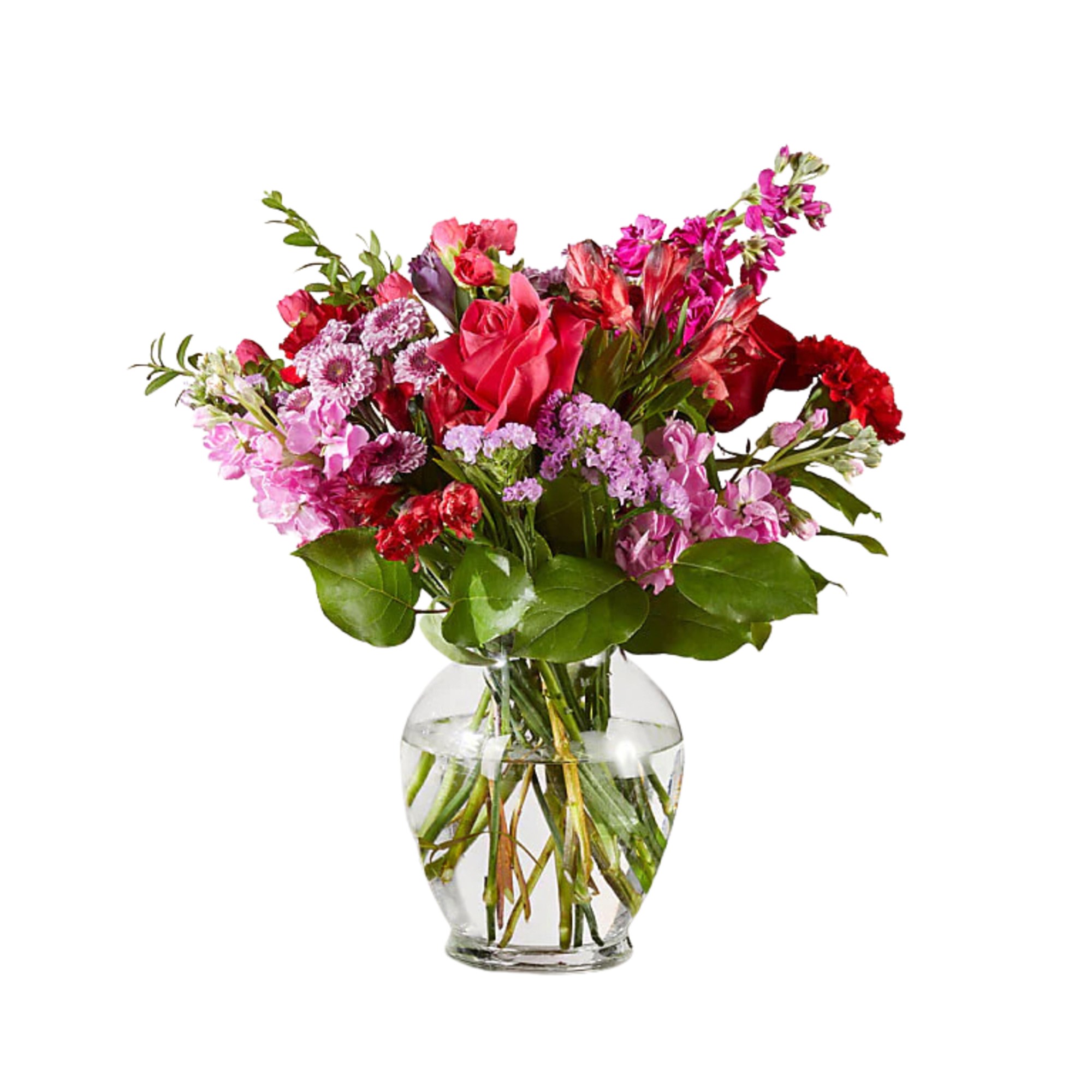 Mixed pink and red bouquet in a clear glass vase