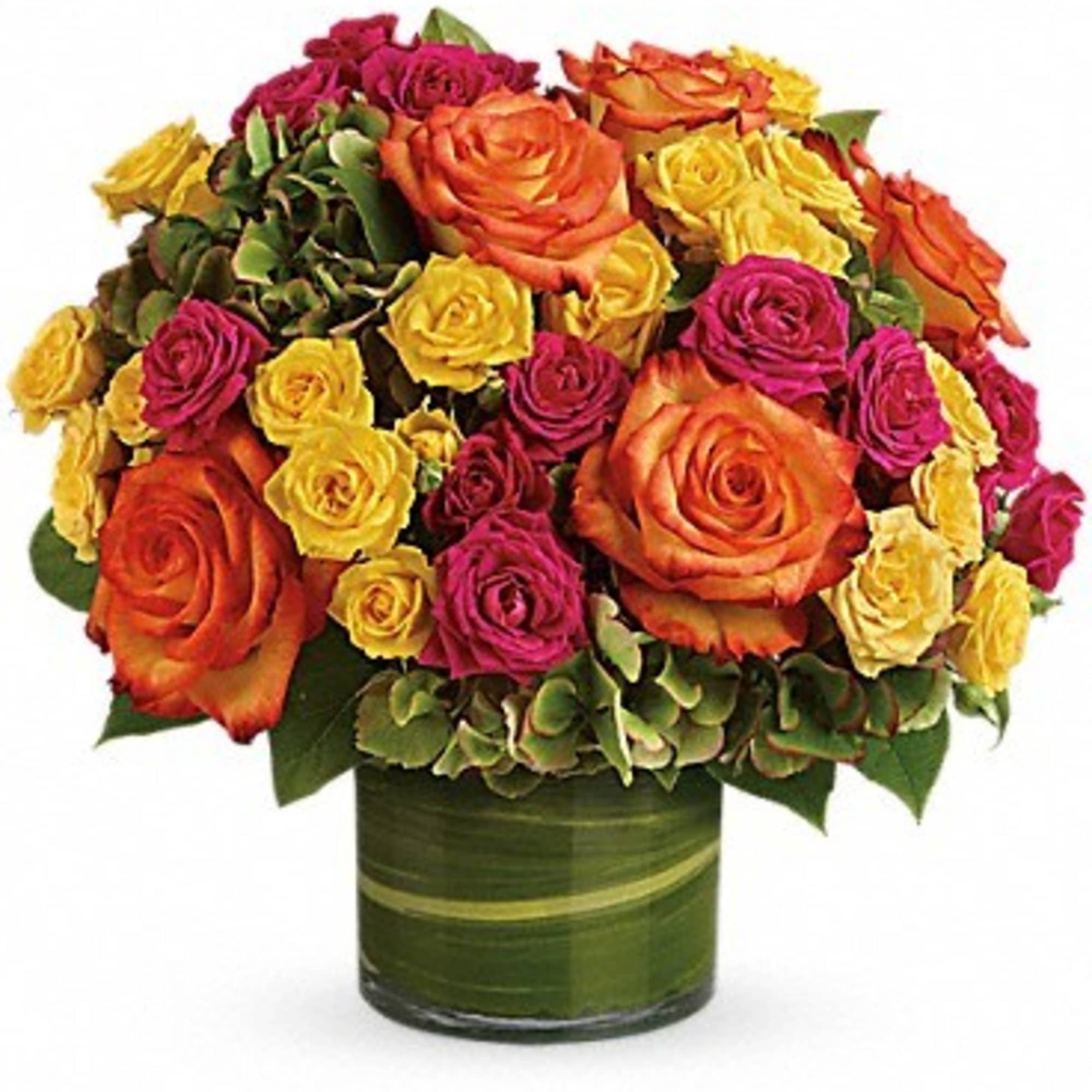 Mixed roses in orange, yellow, and magenta arranged in a green vase