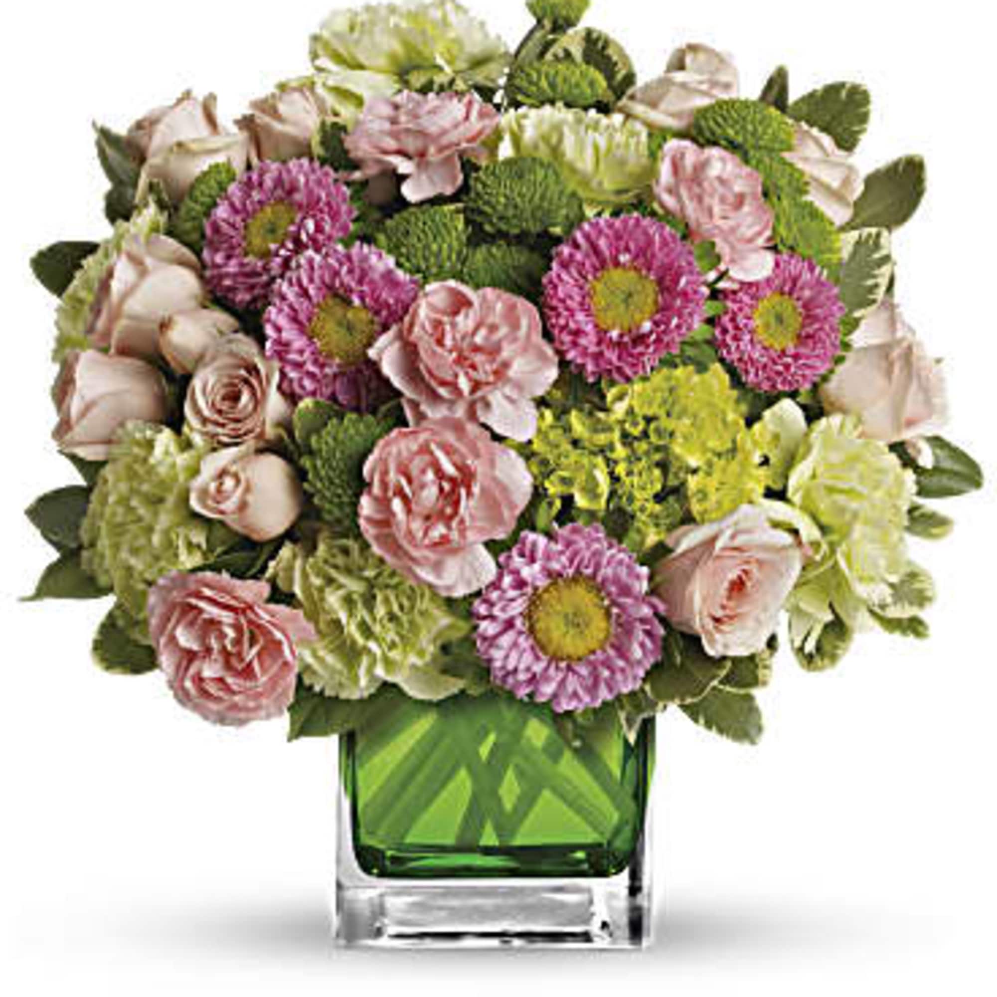 Sweetly sophisticated, this arrangement of green miniature hydrangea and light pink spray