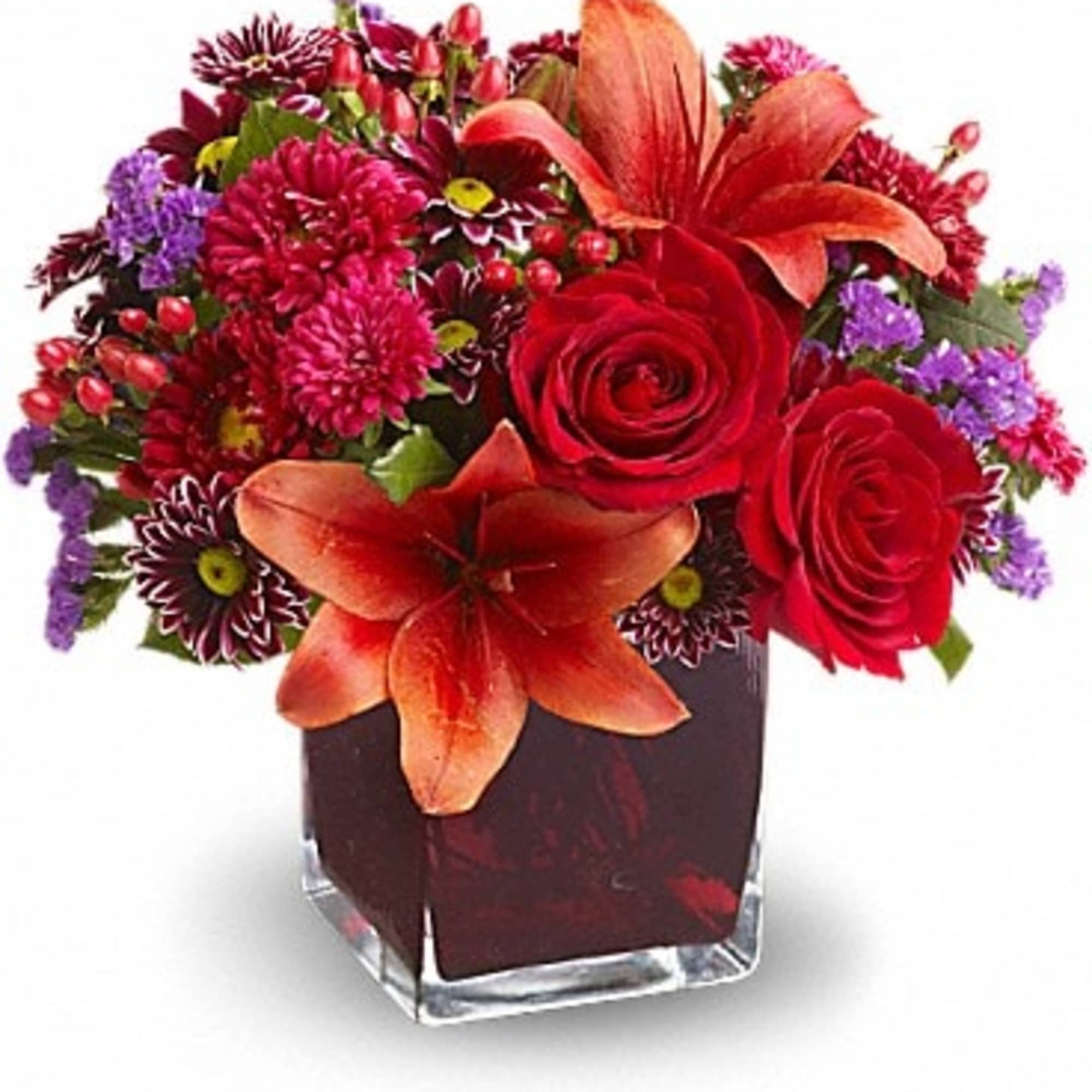 Roses, lilies and asters in precious gemstone colors of garnet are nestled
