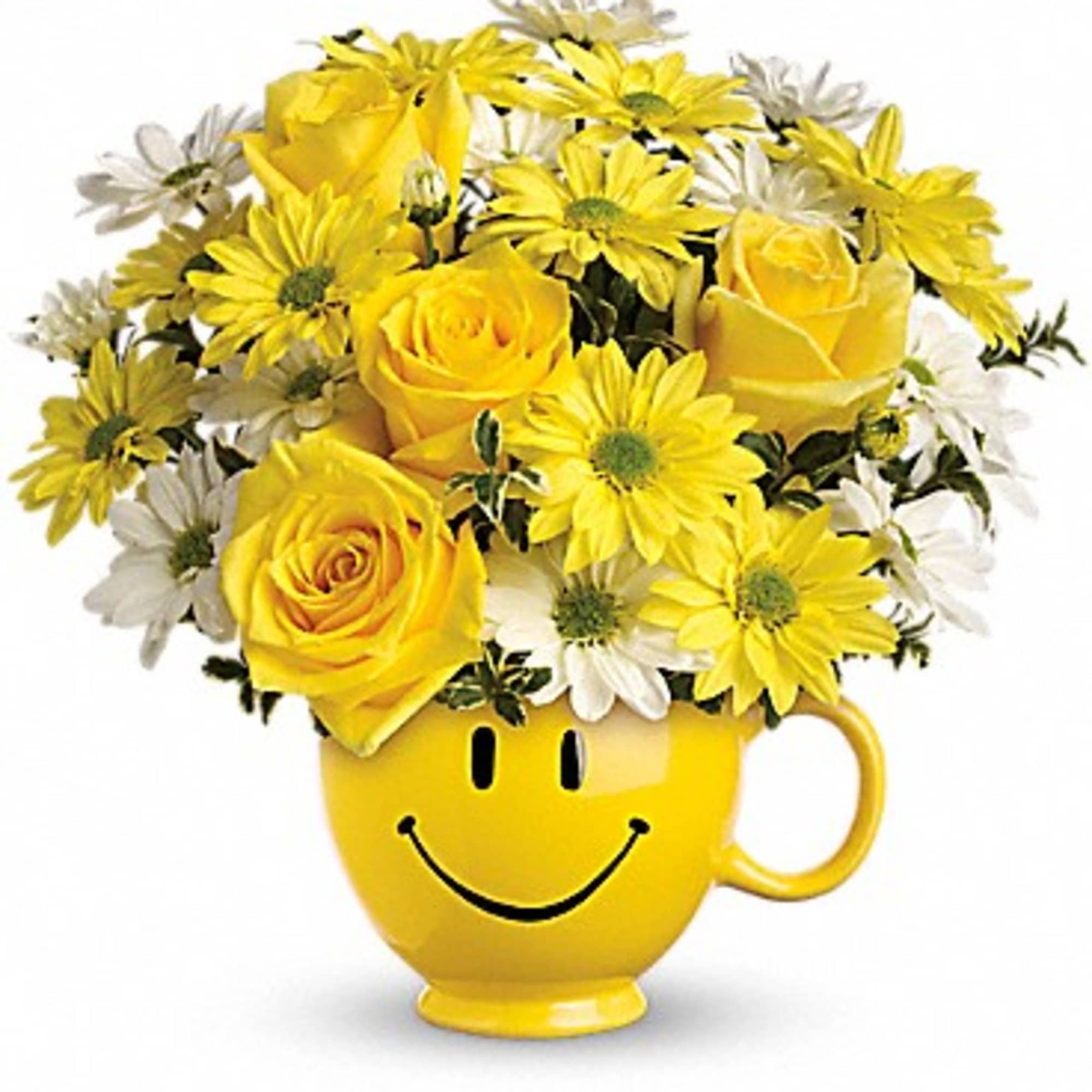 Yellow roses and daisies arranged in a smiley-face mug