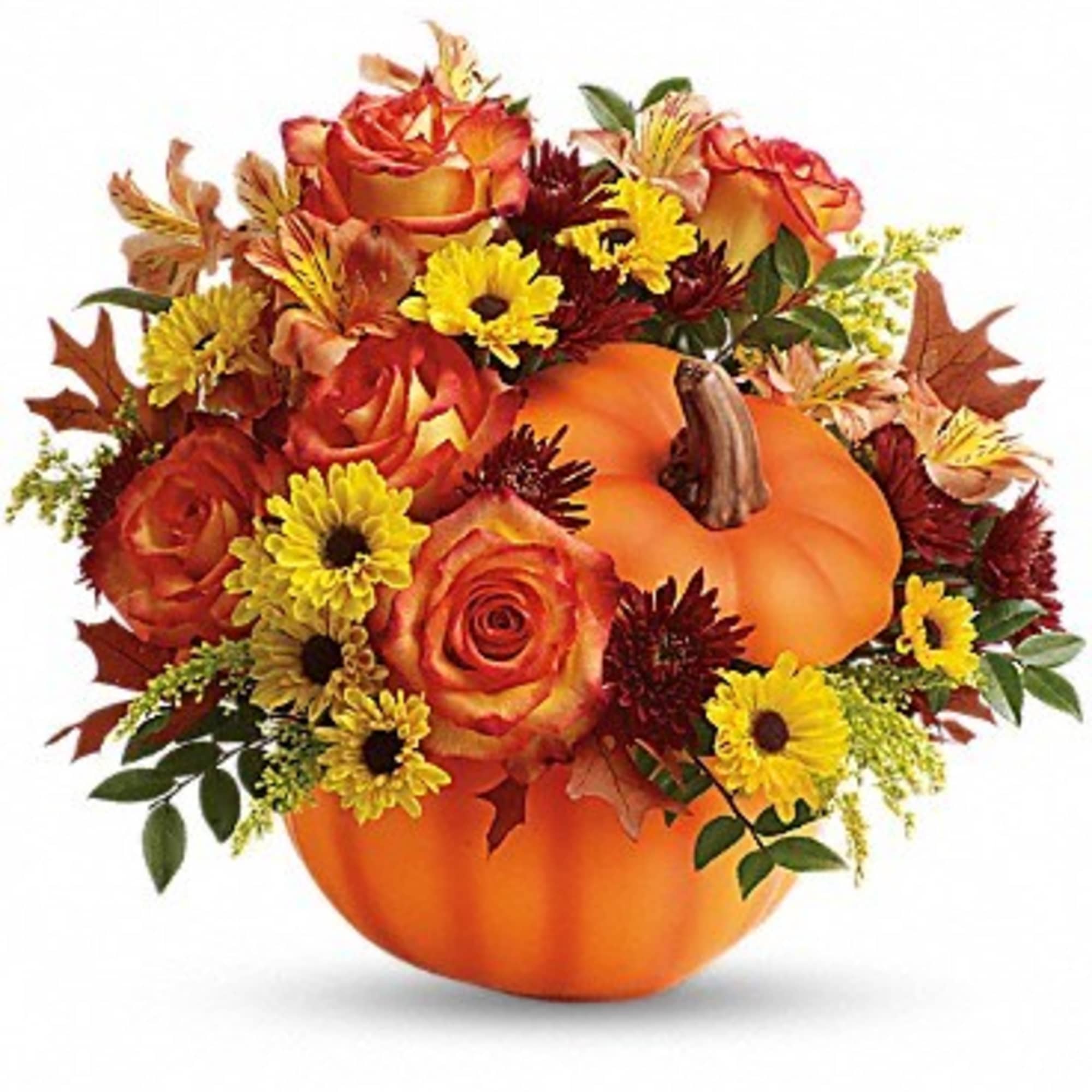 Orange pumpkin filled with roses and yellow daisies