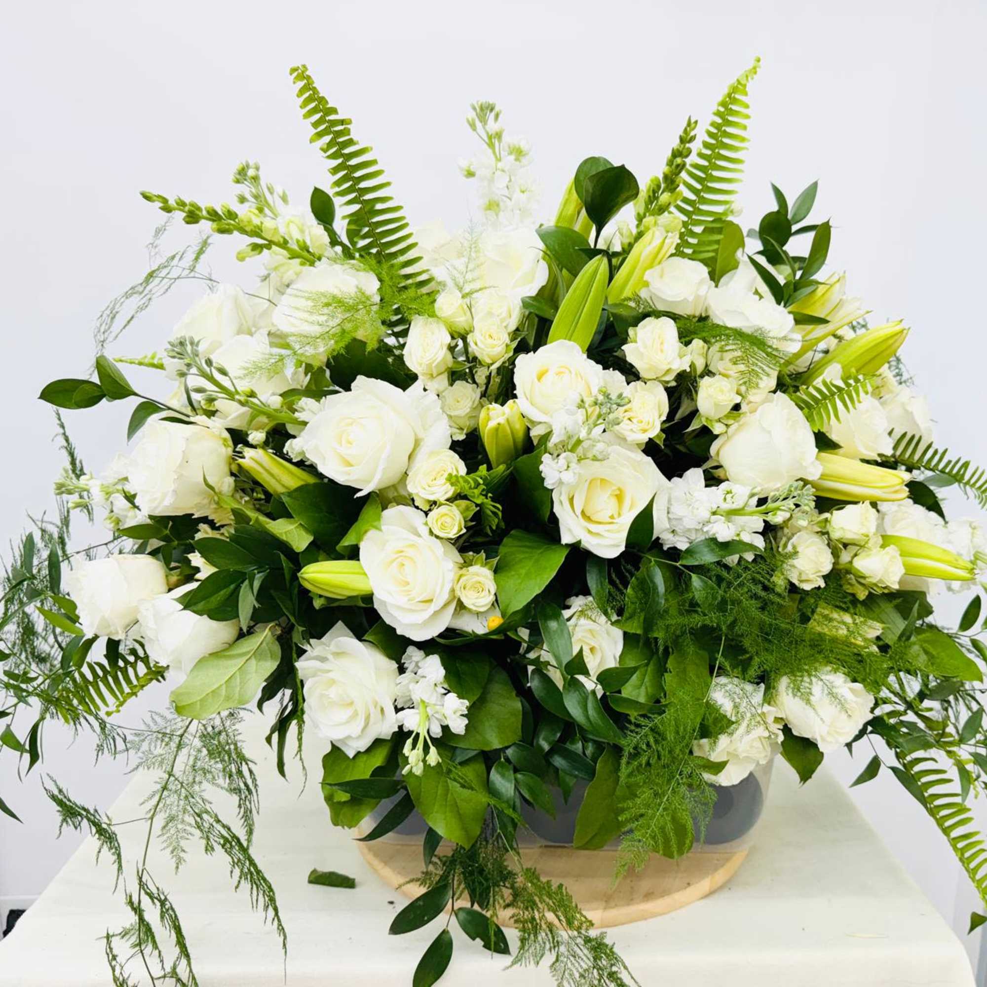 An all white tribute, this half casket spray is pure in color, photo 3 of 3