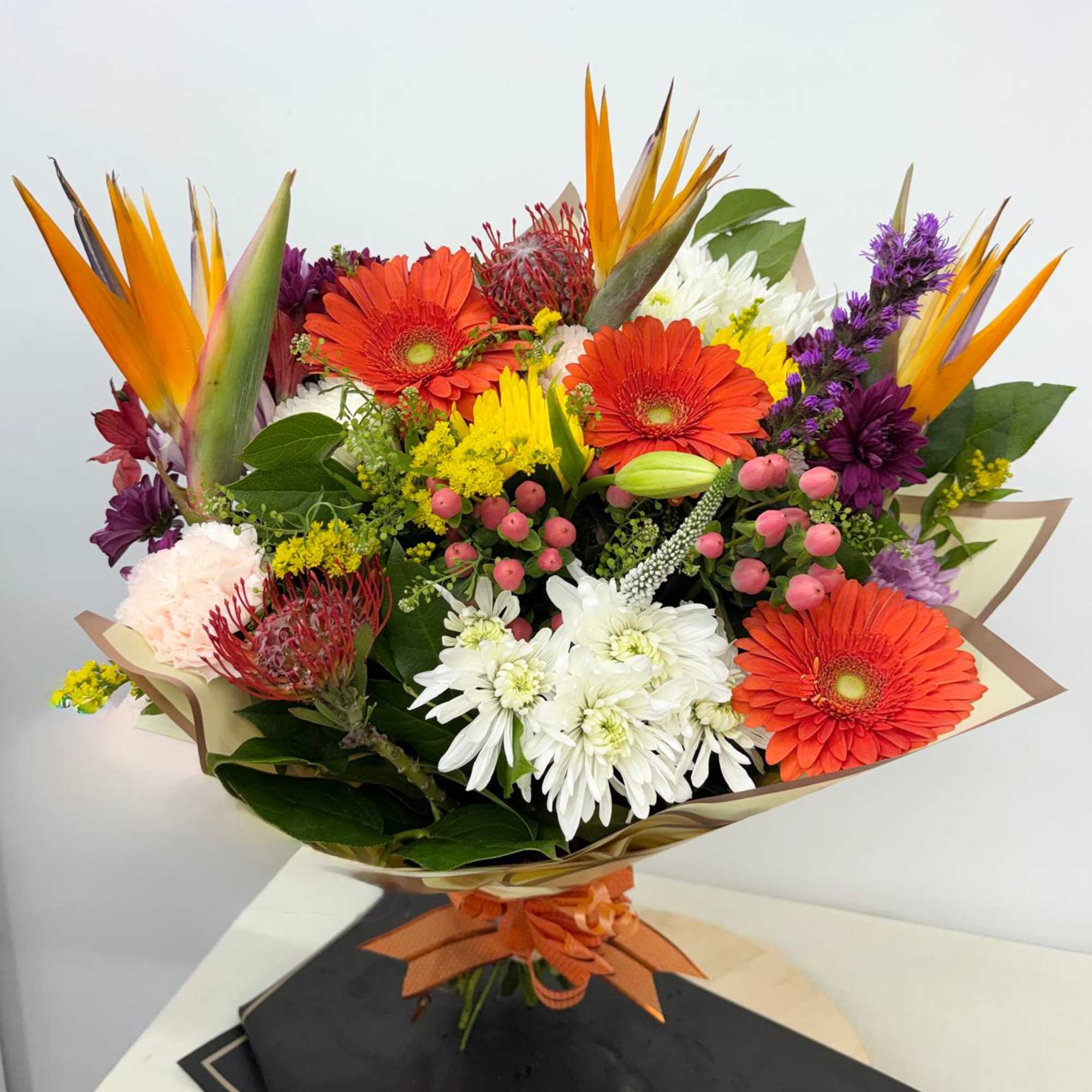 Our Tropical sunset Bouquet is What better choice of flowers than this