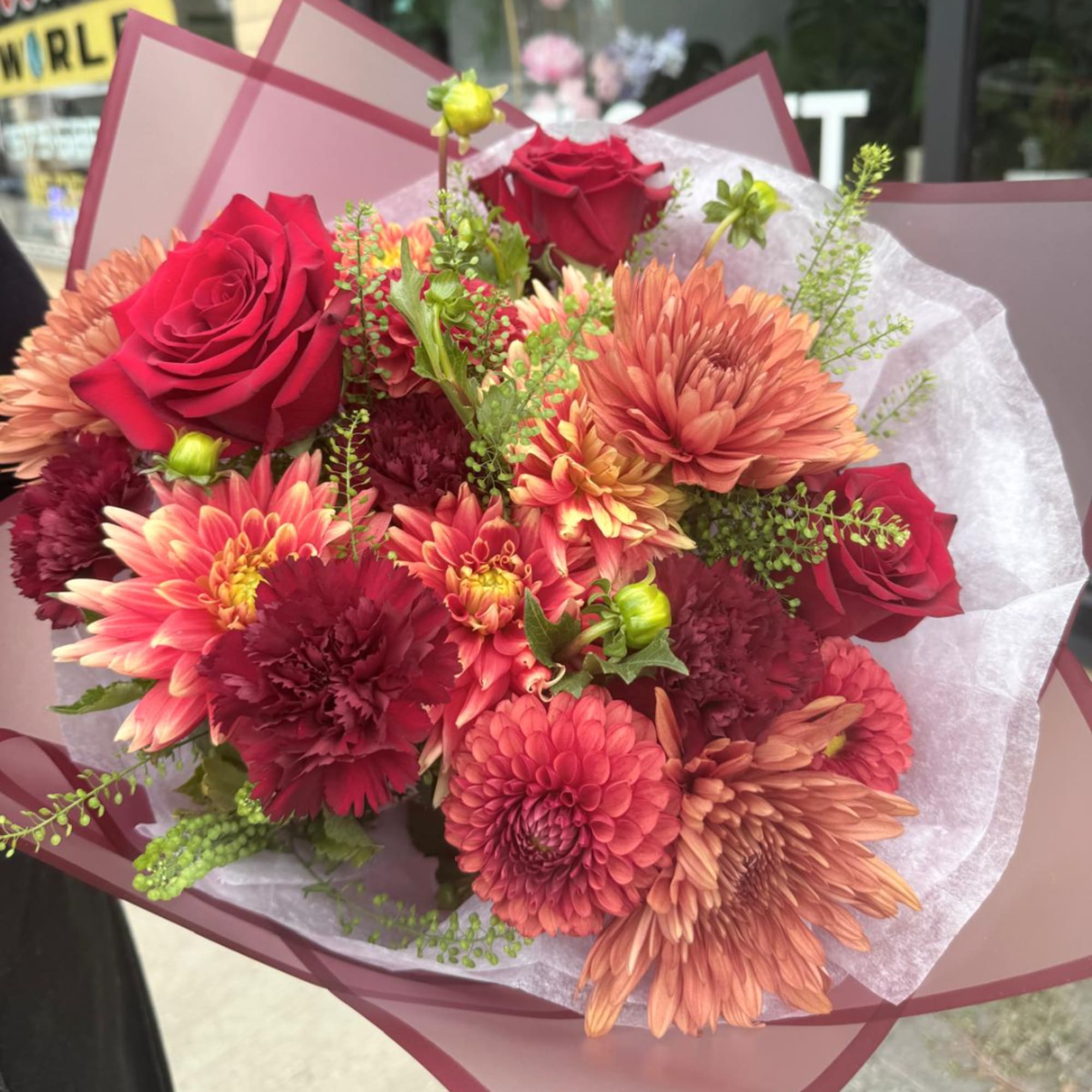 Bouquet of red roses and orange chrysanthemums wrapped in pink paper, photo 4 of 4