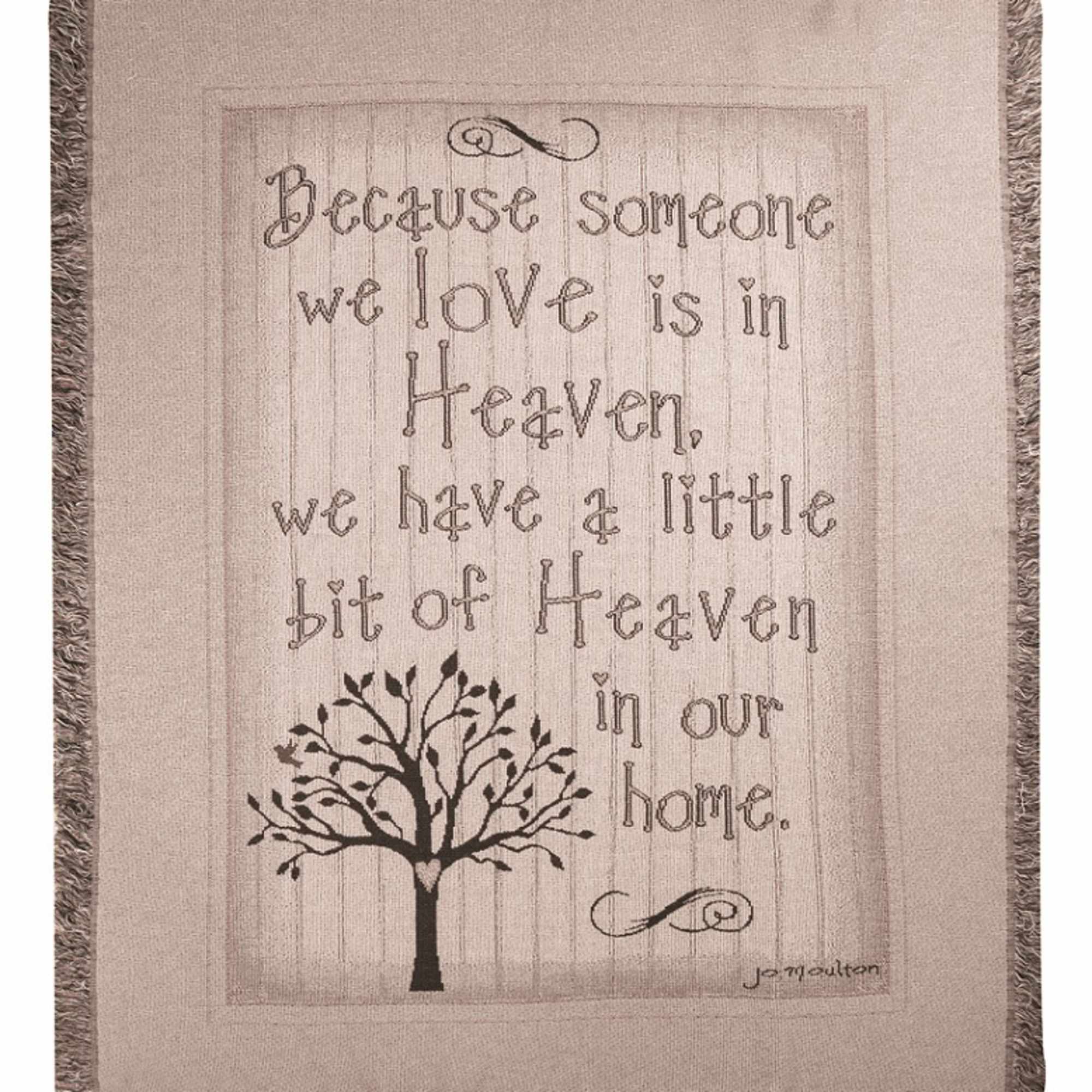 Fringed wall hanging with a quote and tree graphic