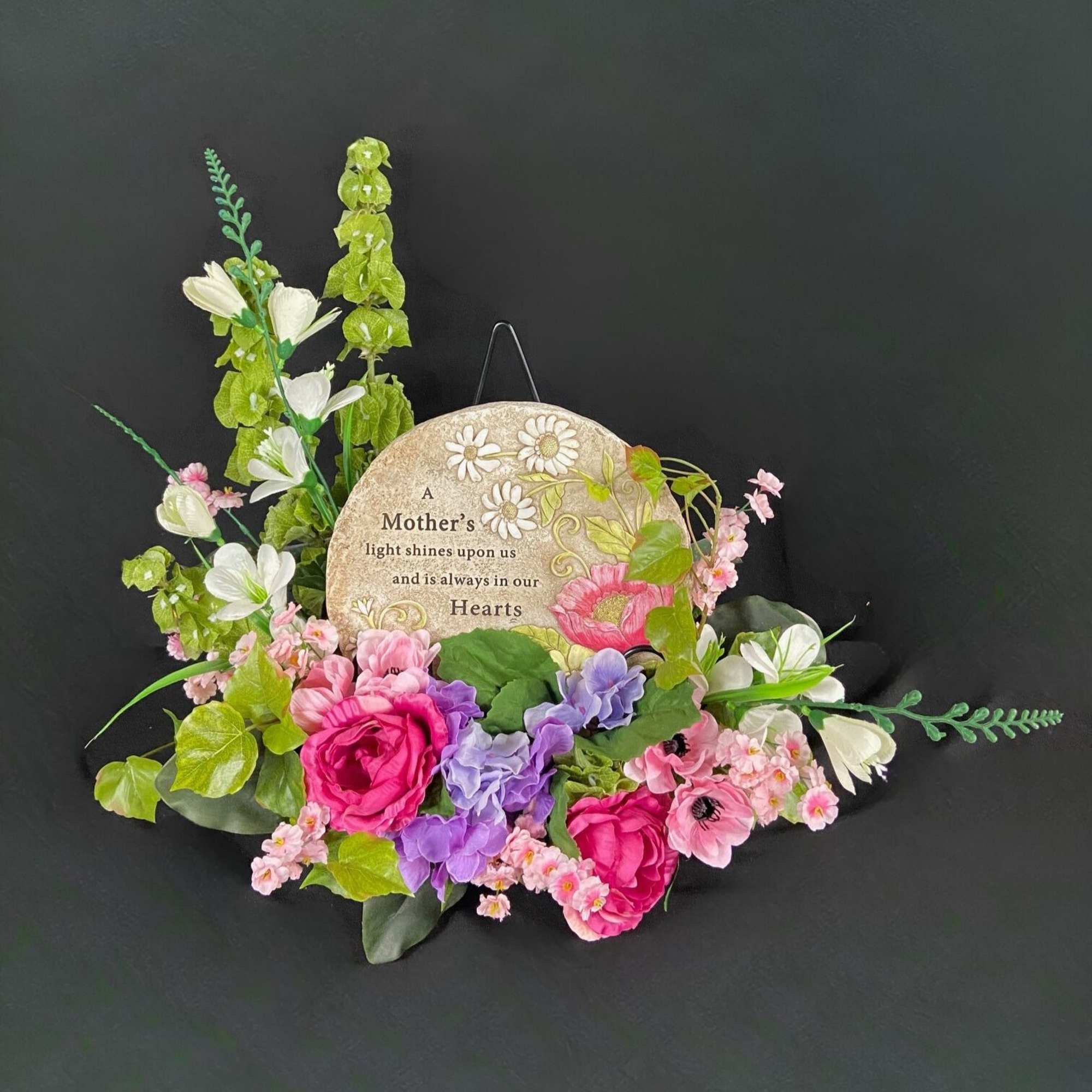 Floral plaque with pink and purple flowers around a Mother's Day sign