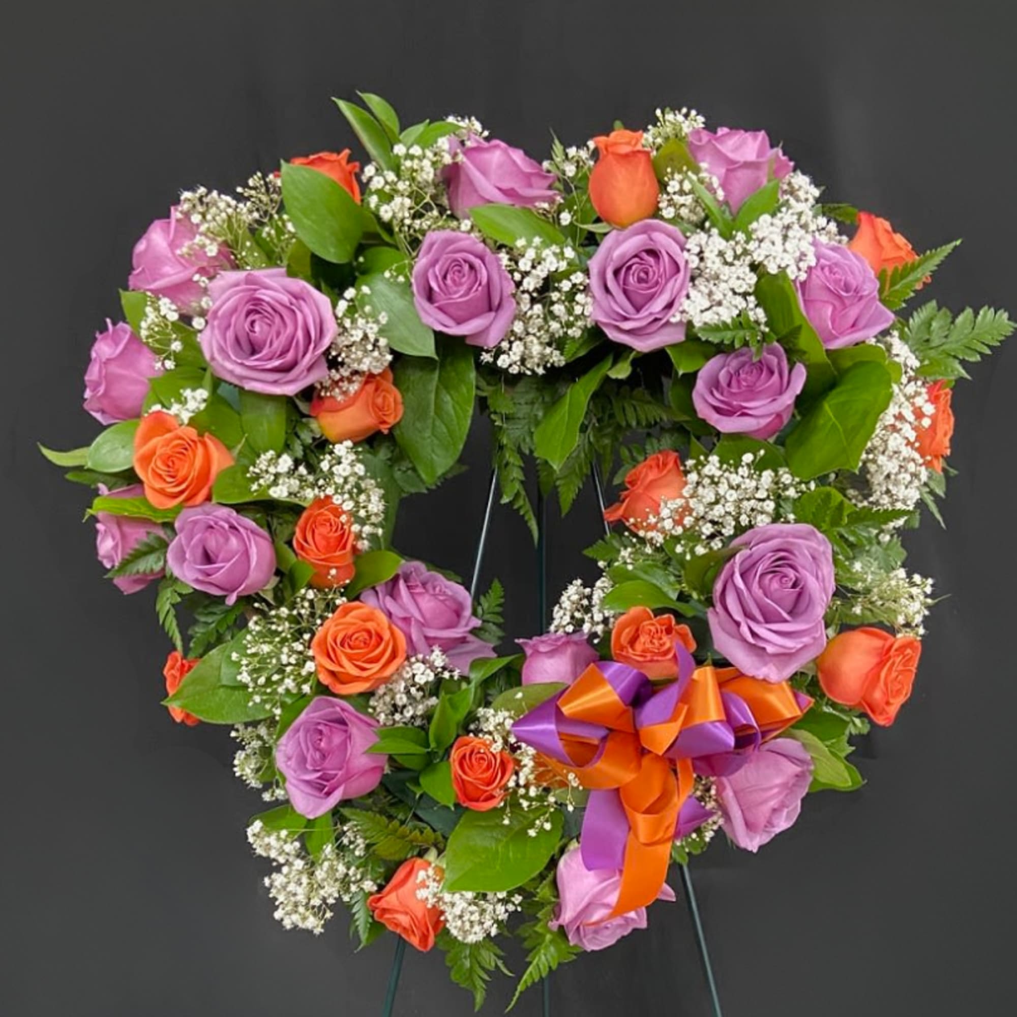 Heart-shaped rose wreath with purple and orange roses