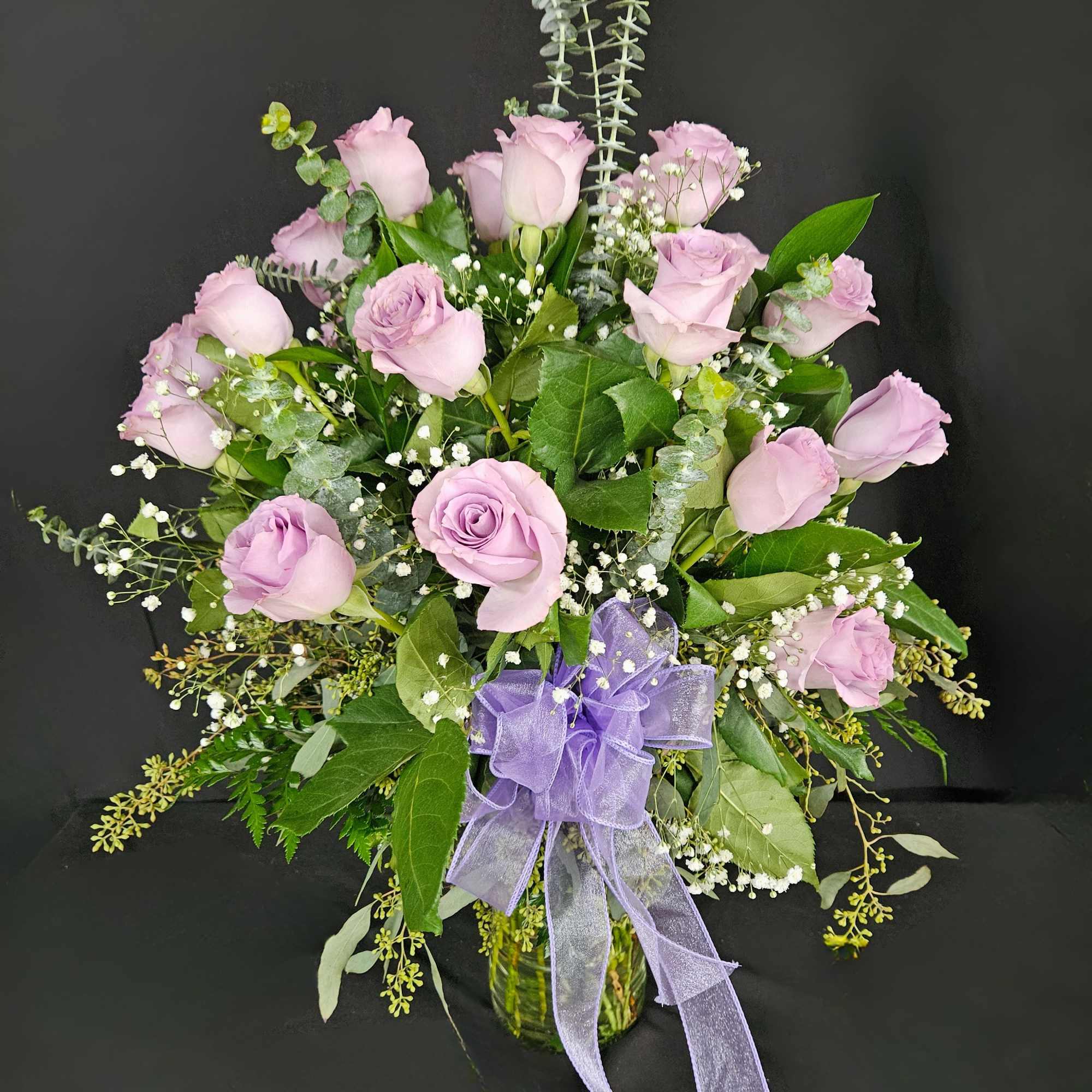 Lavender rose bouquet in a glass vase with a purple ribbon, photo 2 of 2