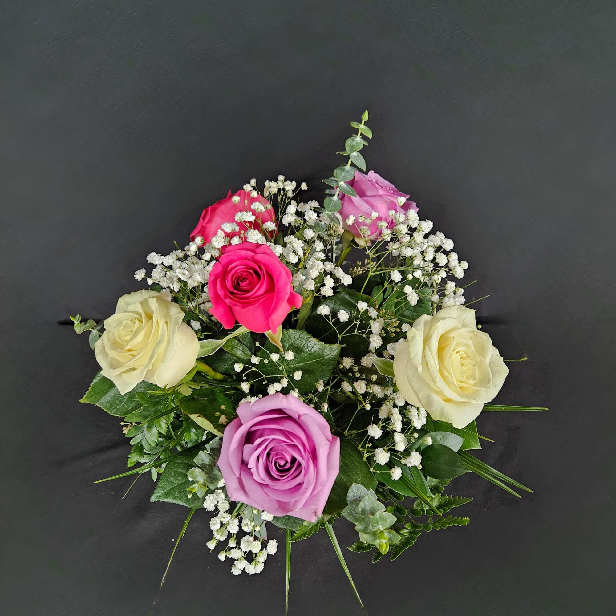 6 beautiful assorted color roses arranged in a vase with baby's breath, photo 2 of 3
