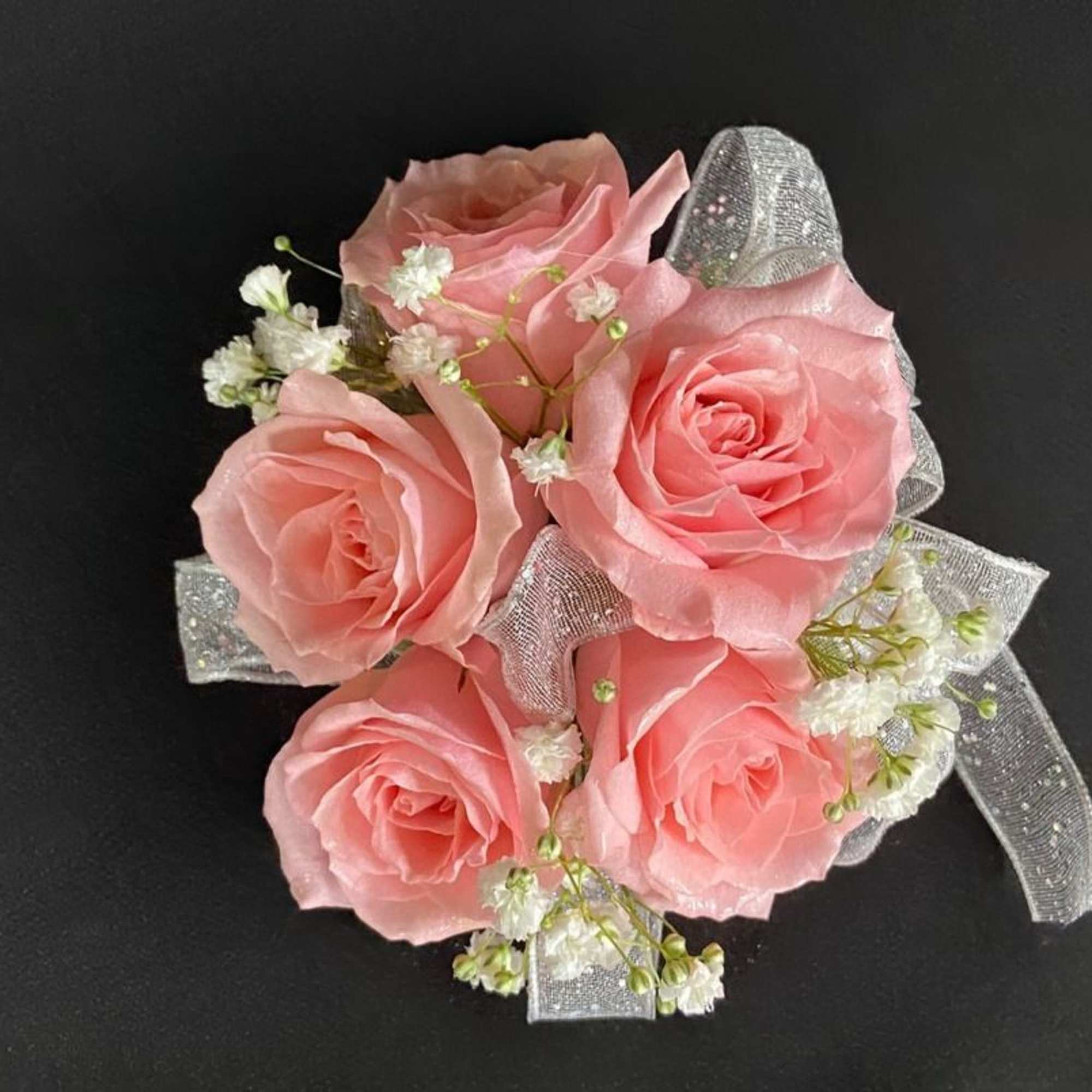 A beautiful spray rose corsage that will compliment any outfit. Please select, photo 2 of 3