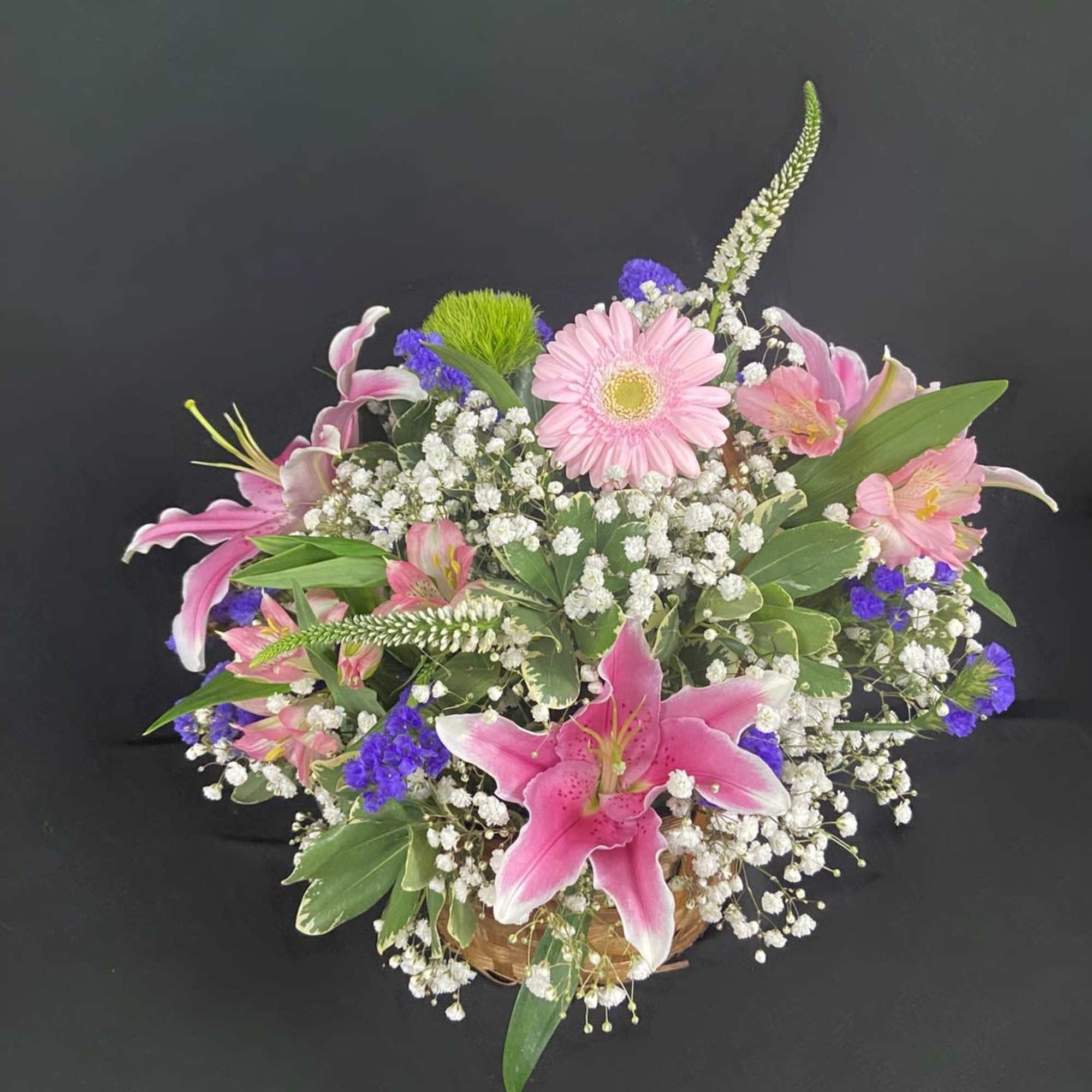 A delightful basket filled with fragrant flowers including Stargazer Lilies, Alstroemeria, Gerbera