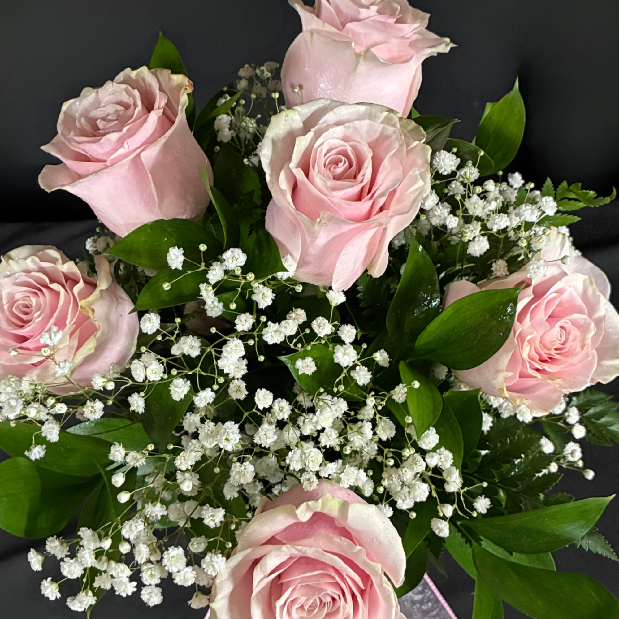 Bouquet of pale pink roses with white baby's breath