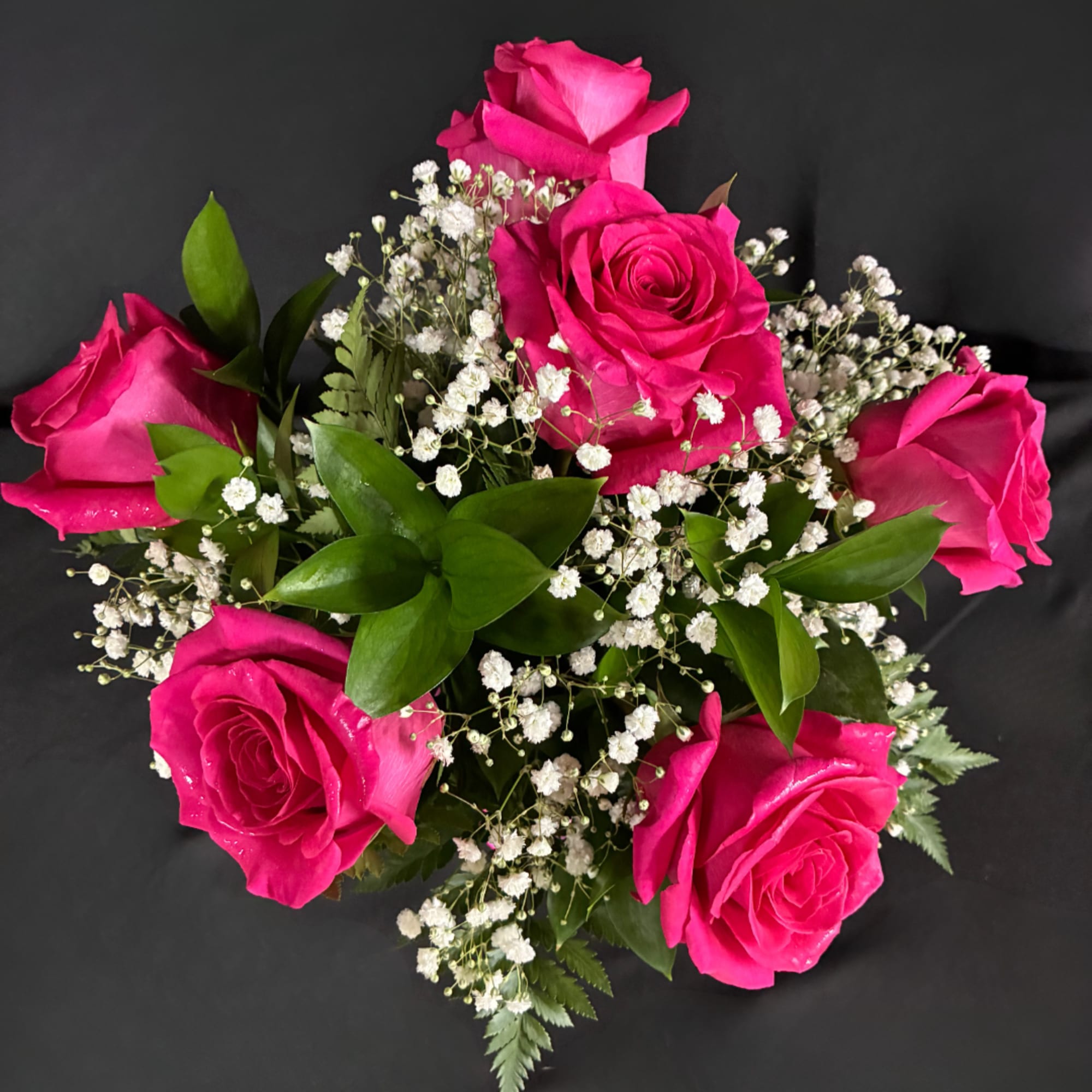 Bouquet of hot pink roses with white baby's breath
