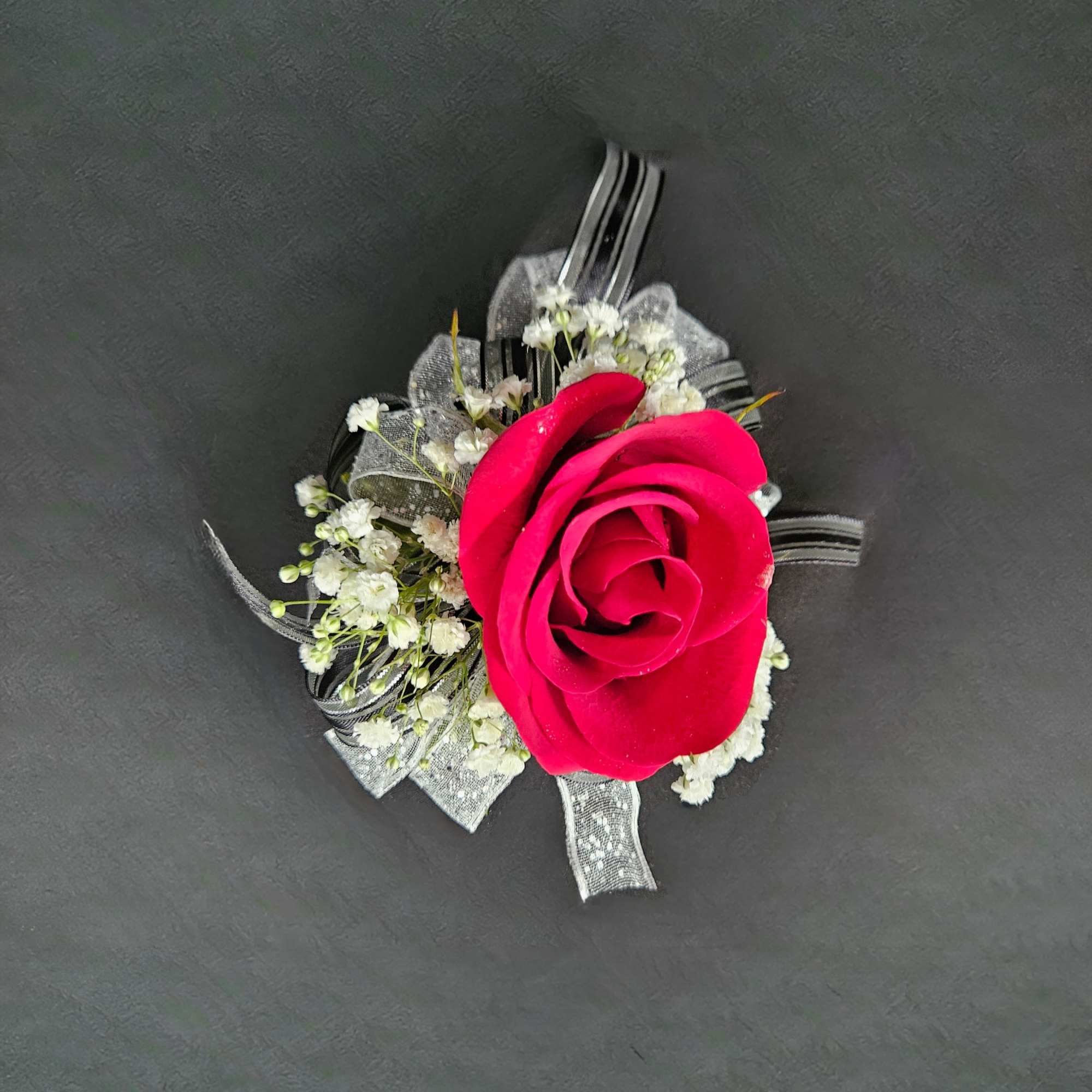 A beautiful rose corsage that will compliment any outfit. Please select the