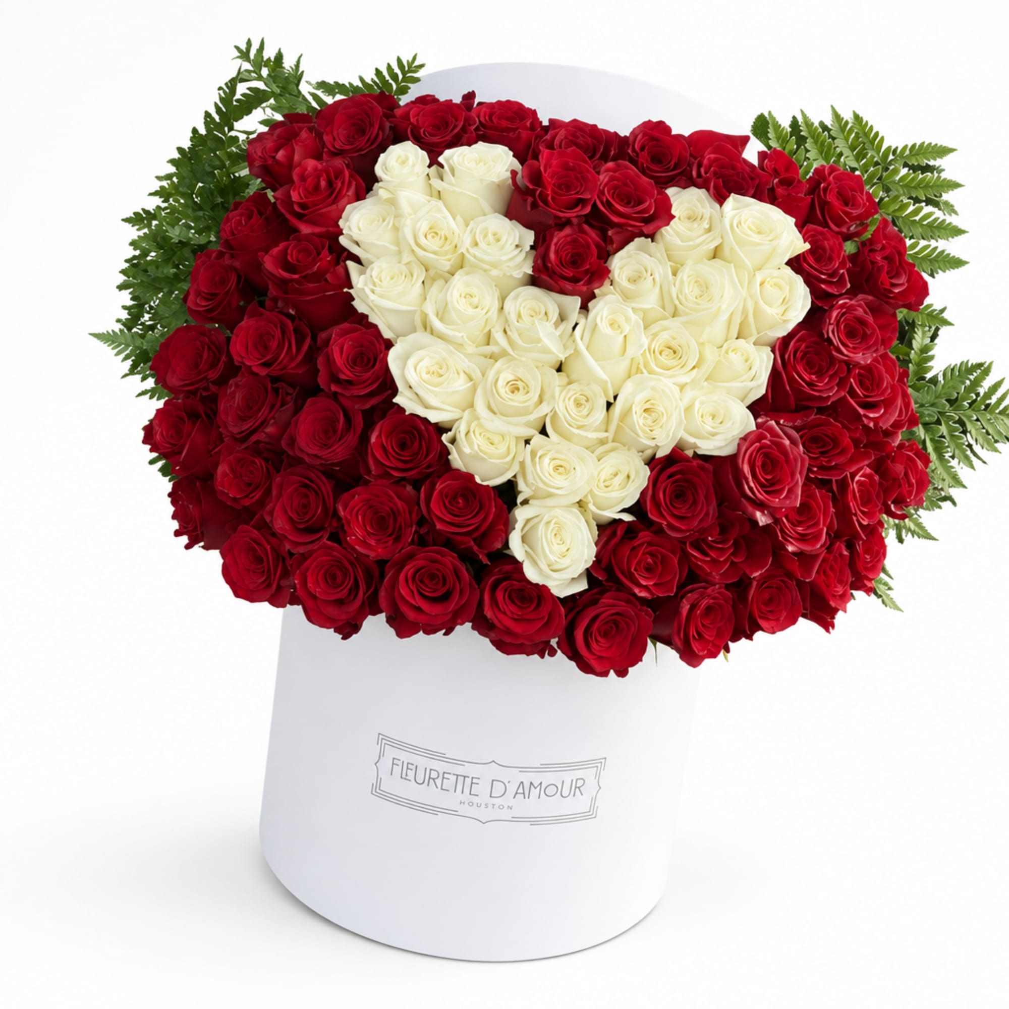 Heart-shaped bouquet of red and white roses in a white hat box