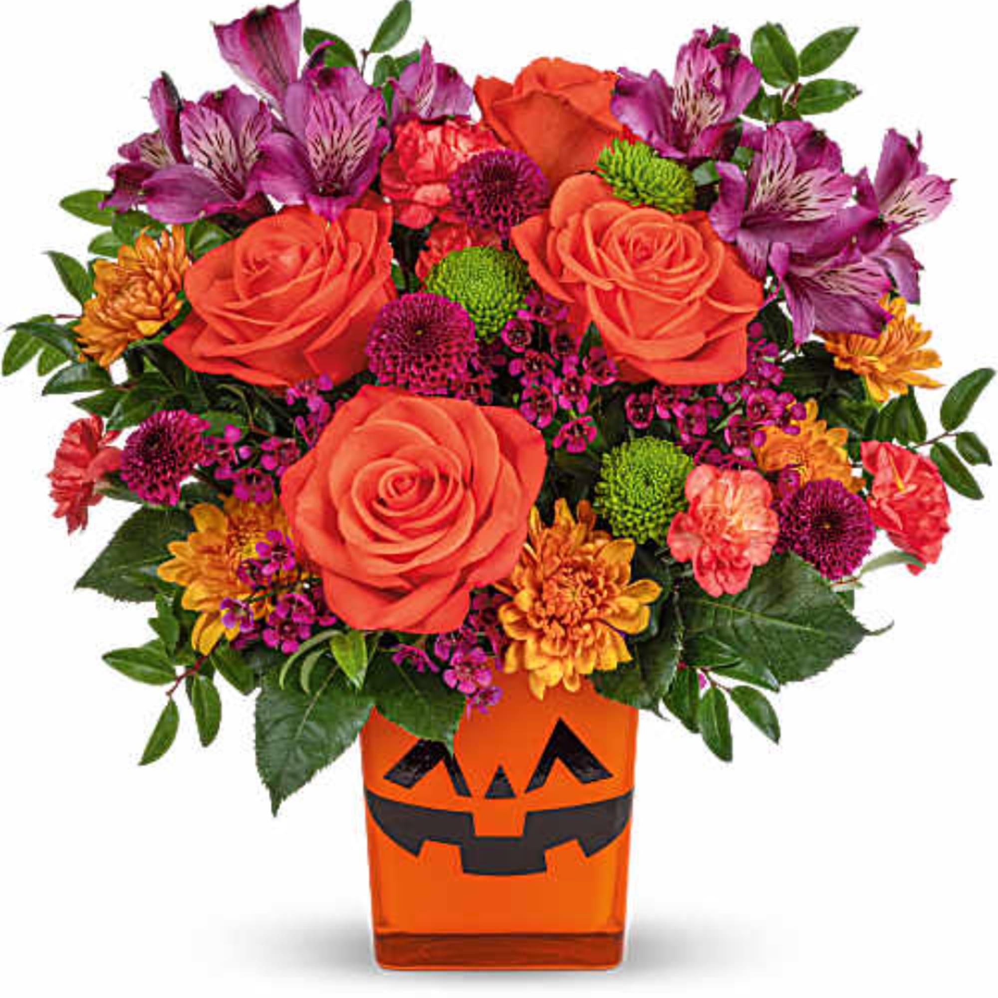 Orange and purple mixed bouquet in a jack-o'-lantern vase