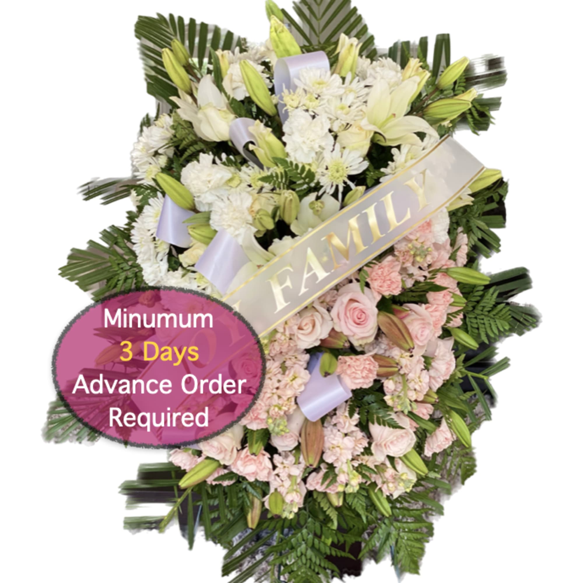 Large funeral spray of white and pale pink flowers with a FAMILY ribbon