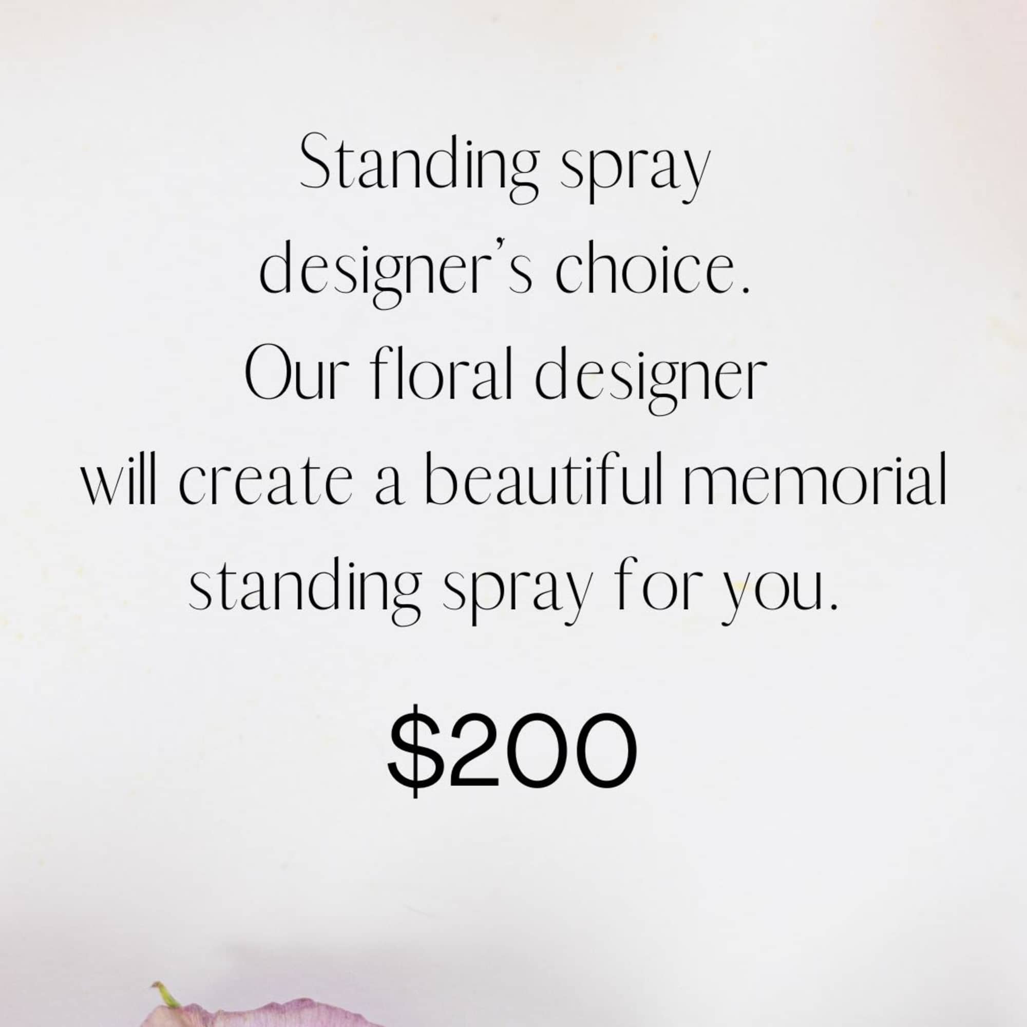 Text ad for a standing spray memorial arrangement with pink and white flowers.