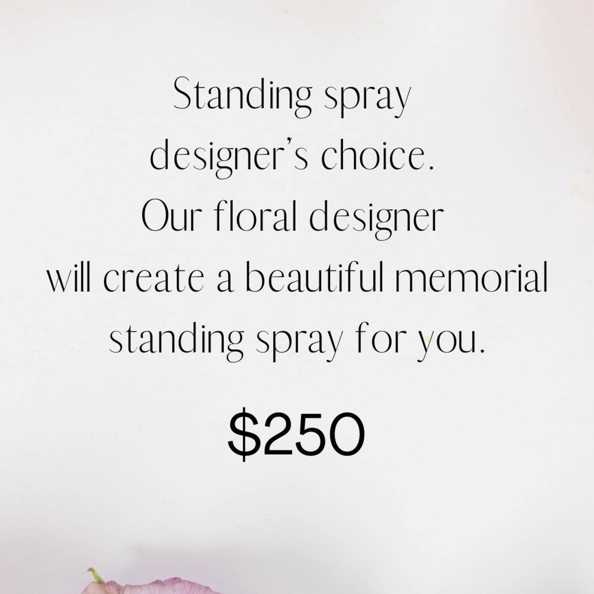 Text ad for a memorial standing spray with pink and white flowers.