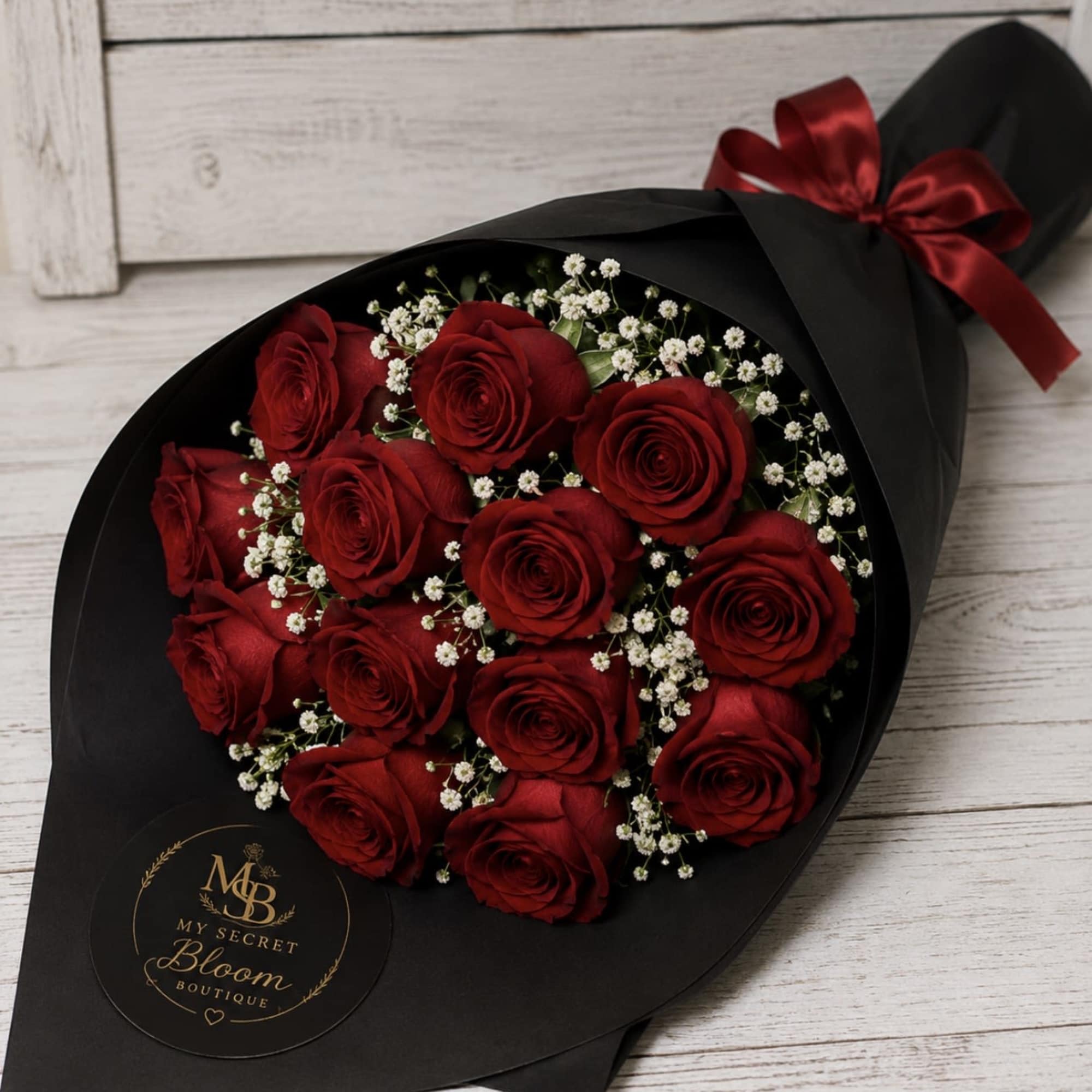 Wrapped bouquet of 12 roses