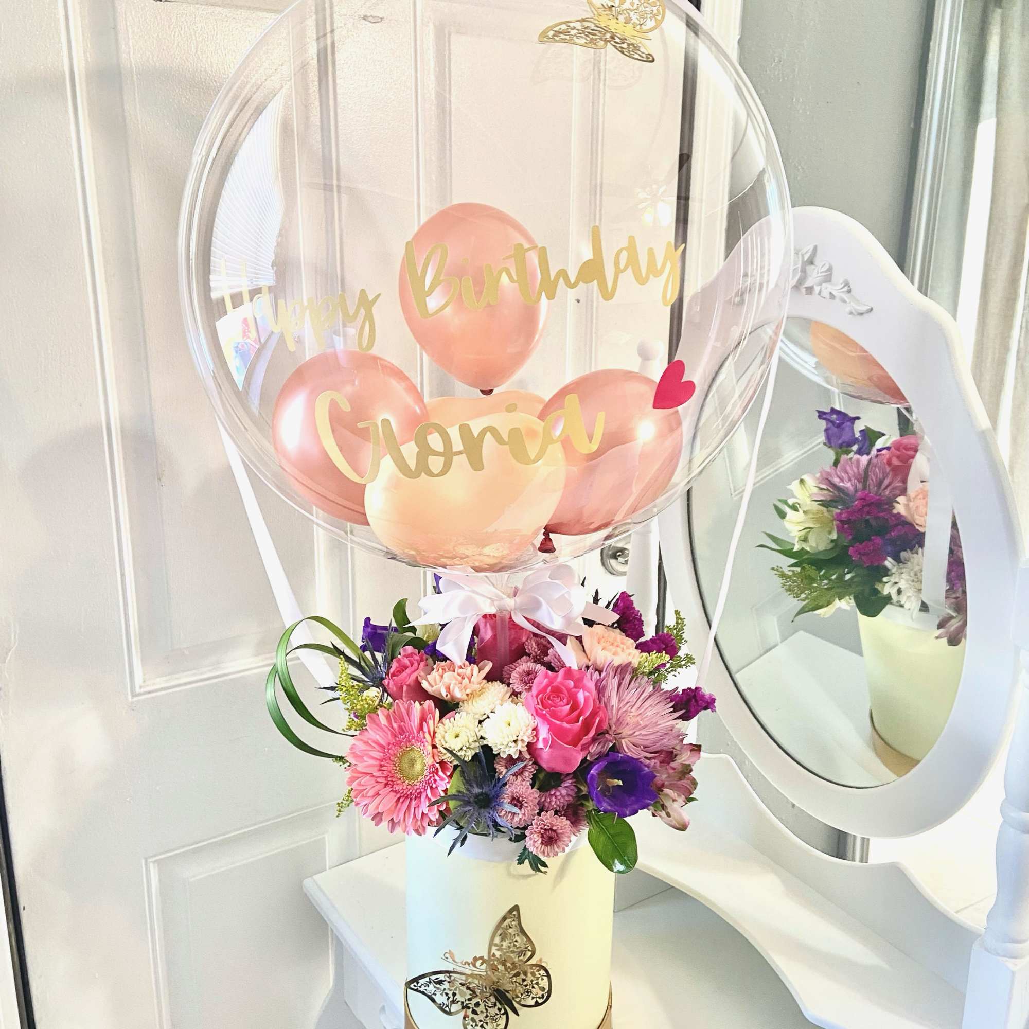 Birthday balloon arrangement with a mixed flower bouquet in a white box