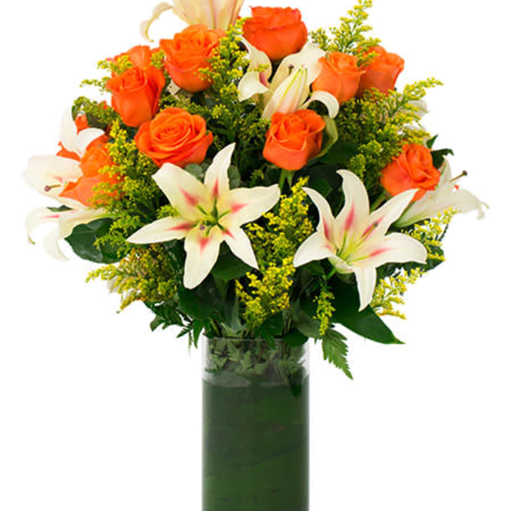 Orange roses and white lilies arranged in a tall glass vase