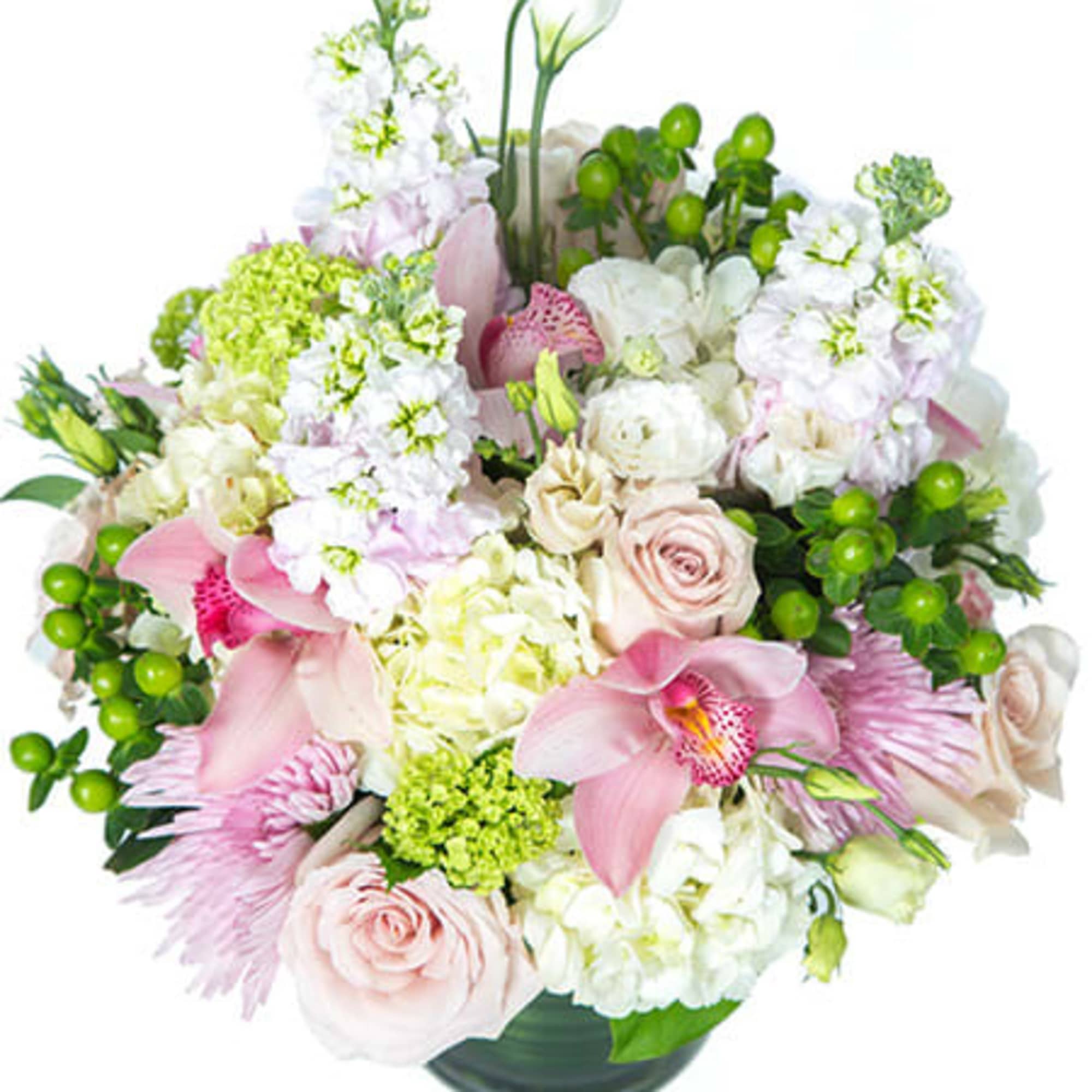 Pastel arrangement of pink orchids, roses, and white hydrangeas in a round glass vase