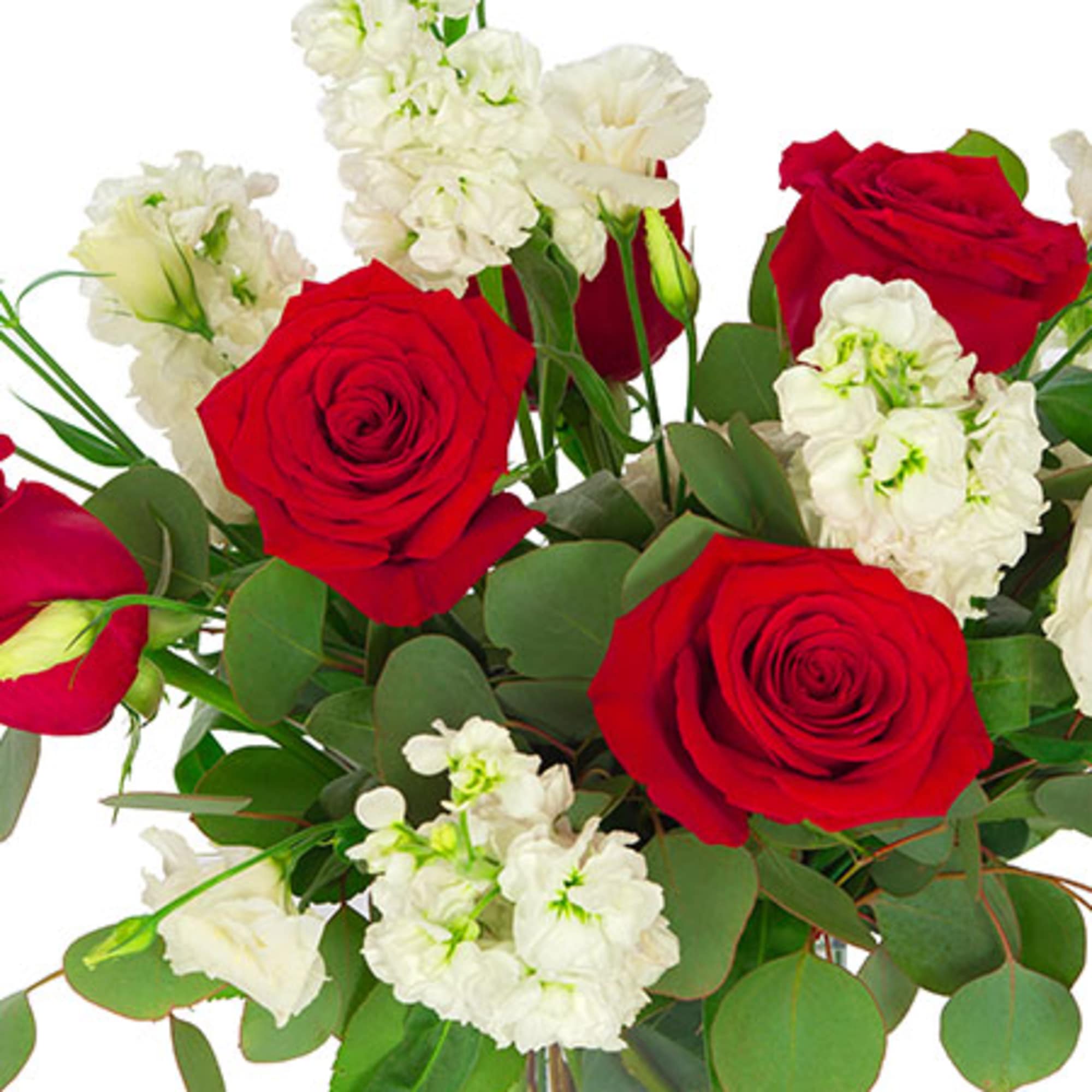 Arrangement of red roses and white flowers in a clear glass vase