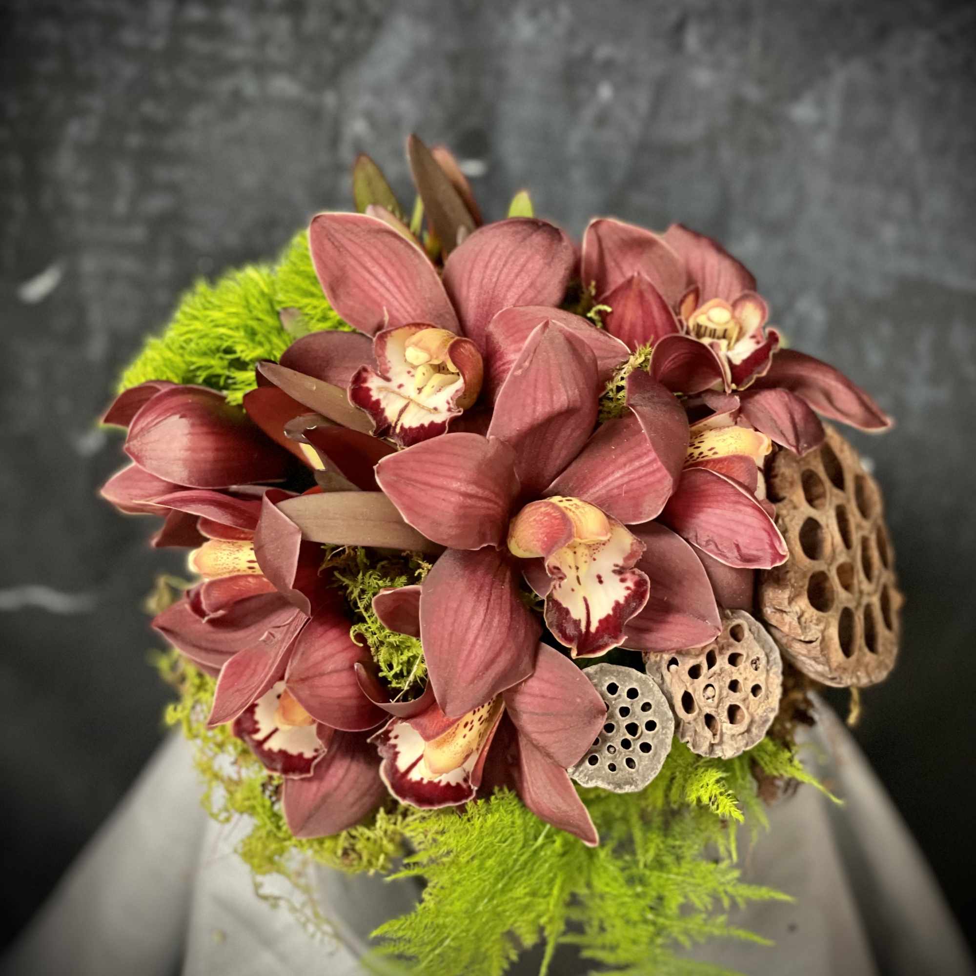 Cymbidium, green dianthus, lotus and greenery., photo 2 of 2