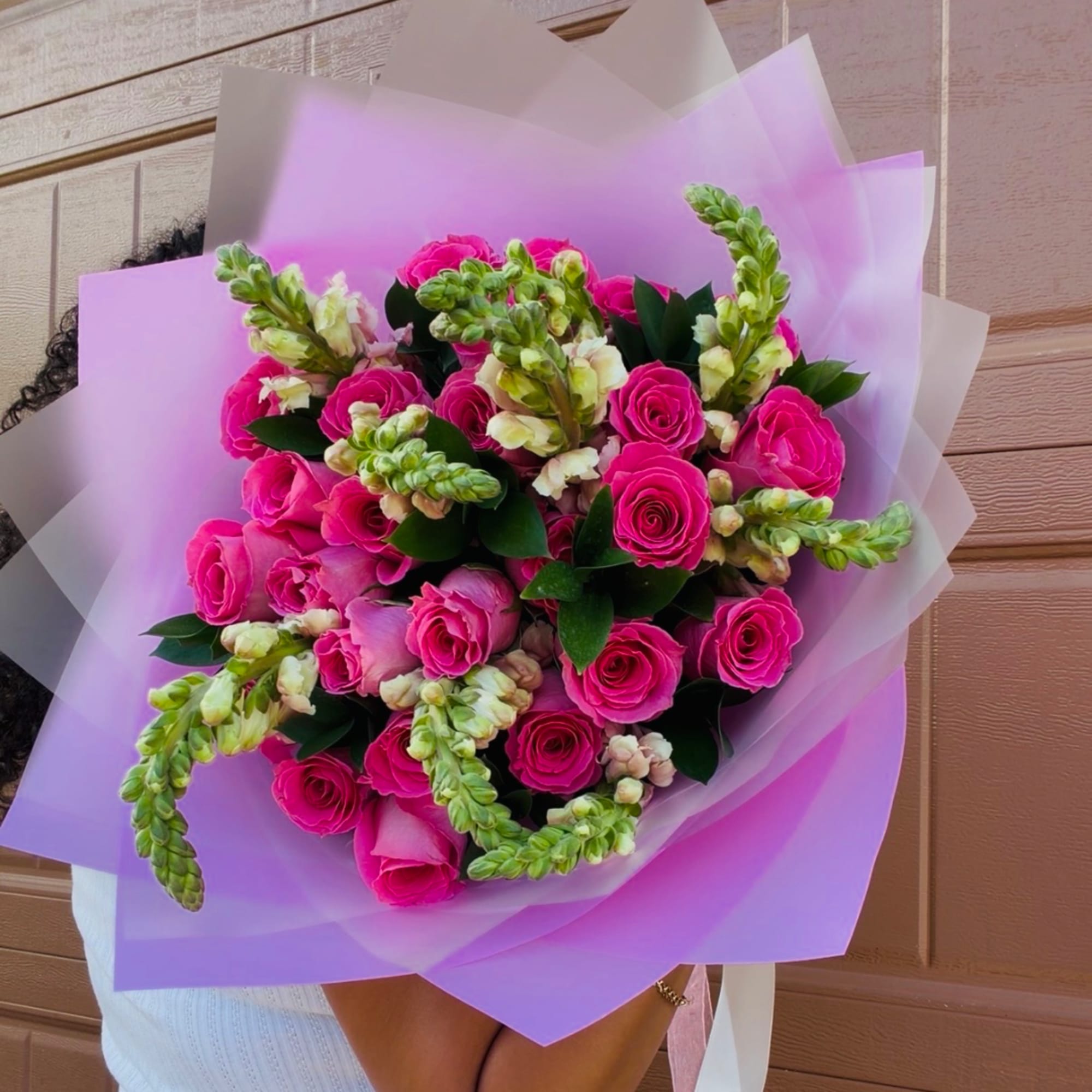 A beautiful celebration of pink, this fresh flower bouquet features pink roses