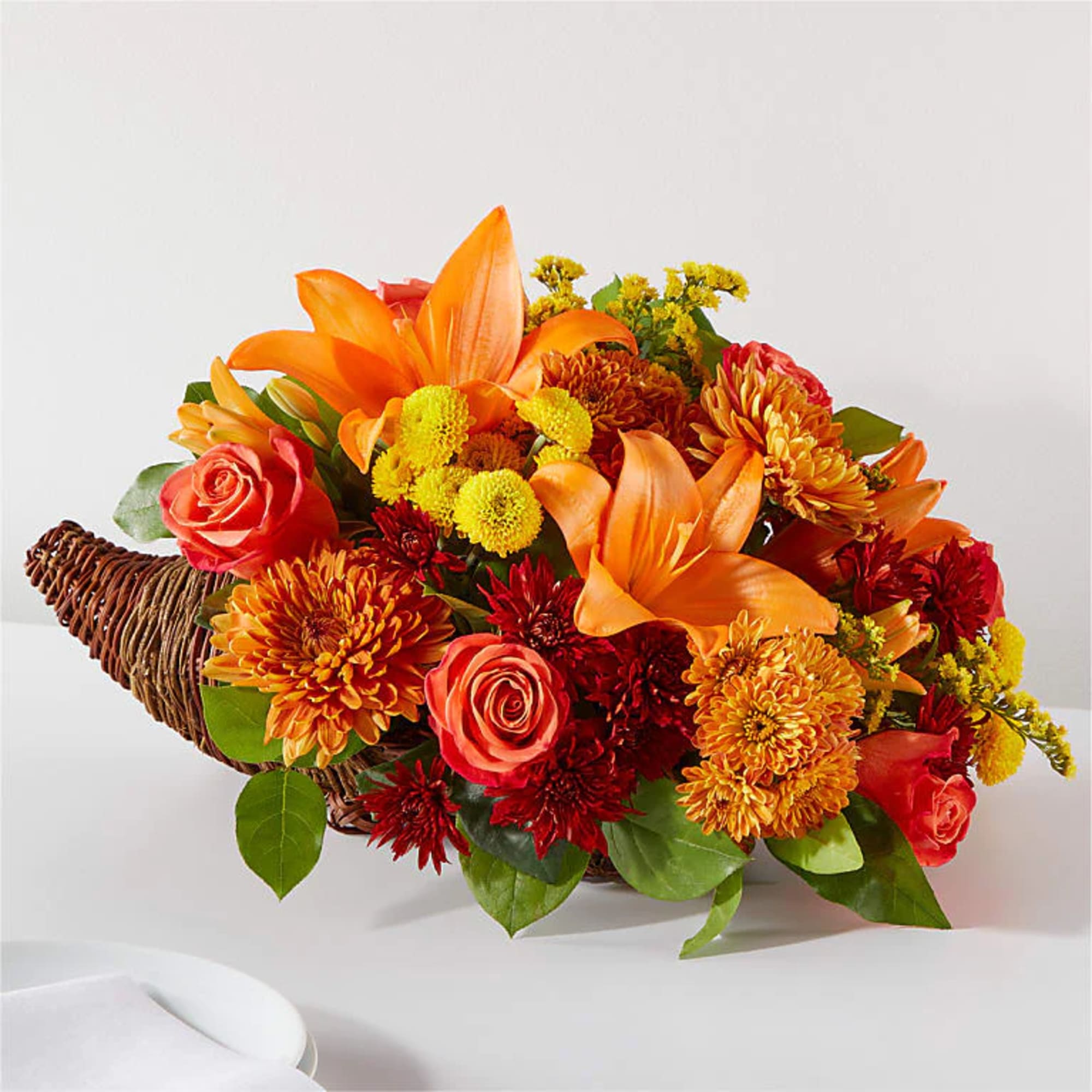 Embrace the spirit of Thanksgiving with a centerpiece that's bursting with bountiful