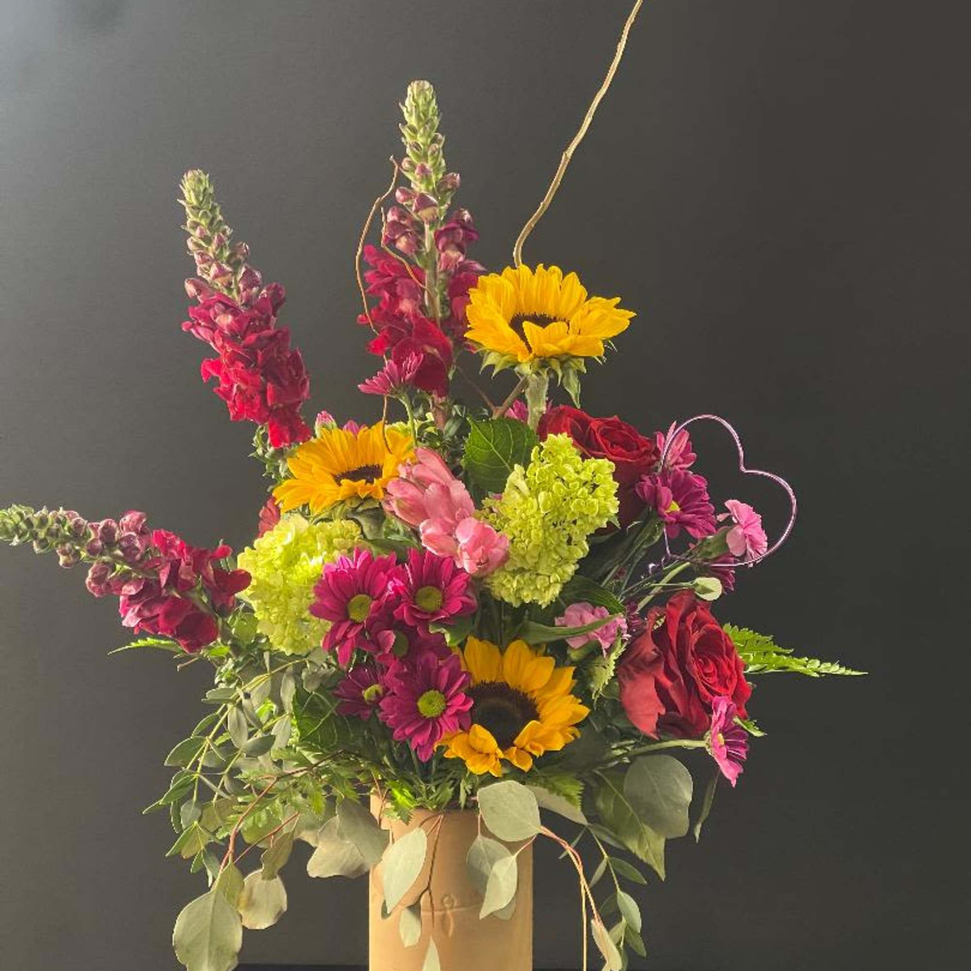 Beautiful, rustic vase with glossy red on the inside.