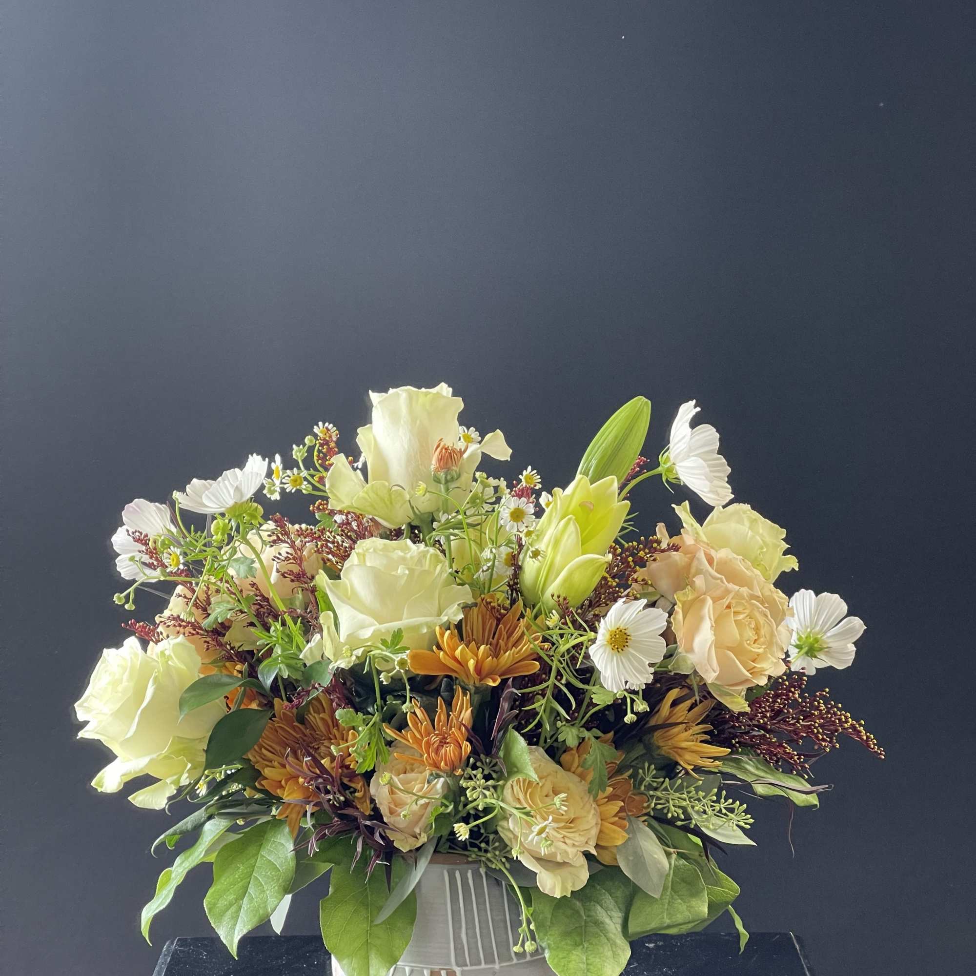 Earthen Elegance &ndash; A captivating blend of purity and opulence, this arrangement