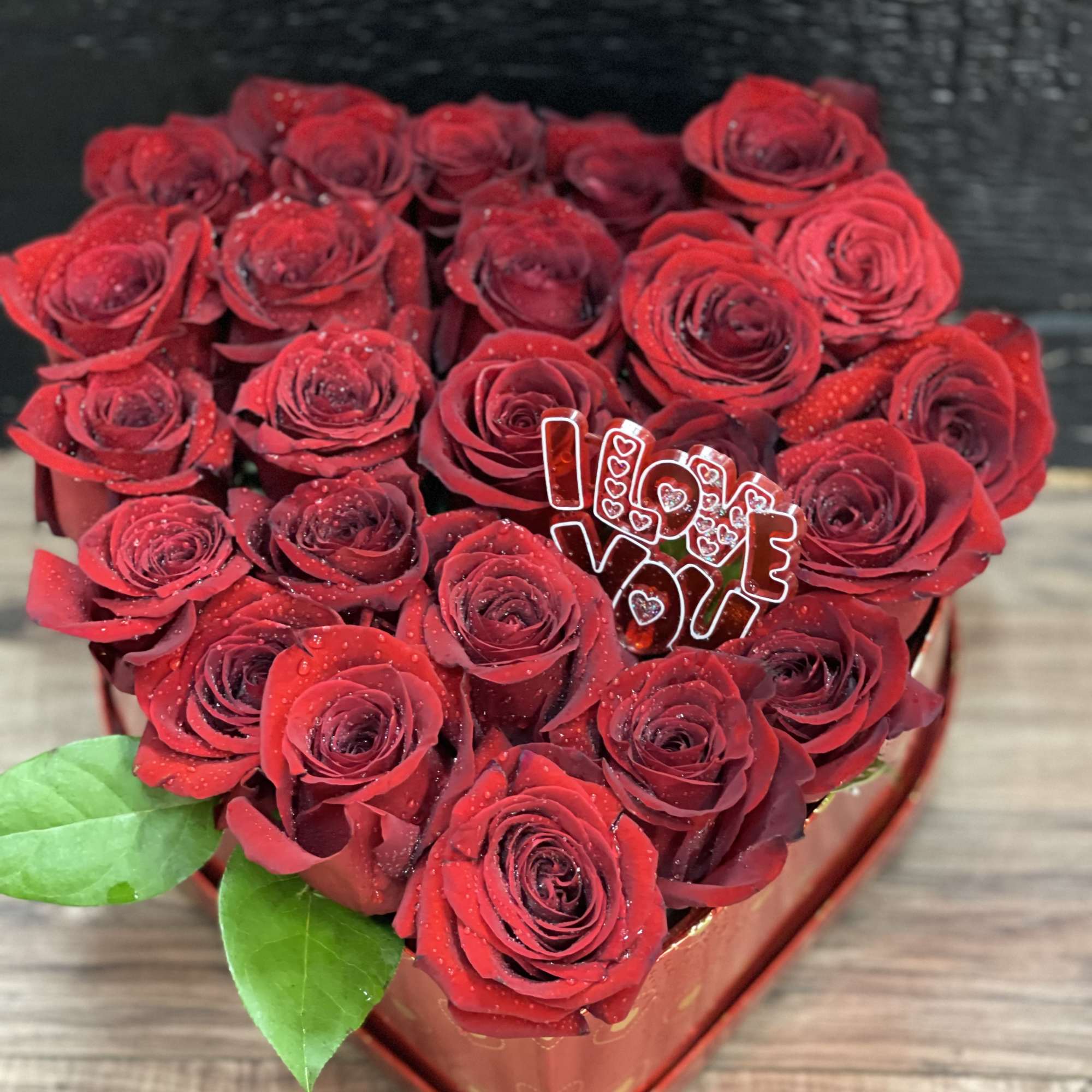 Heart-shaped box of red roses with an "I love you" topper, photo 3 of 3