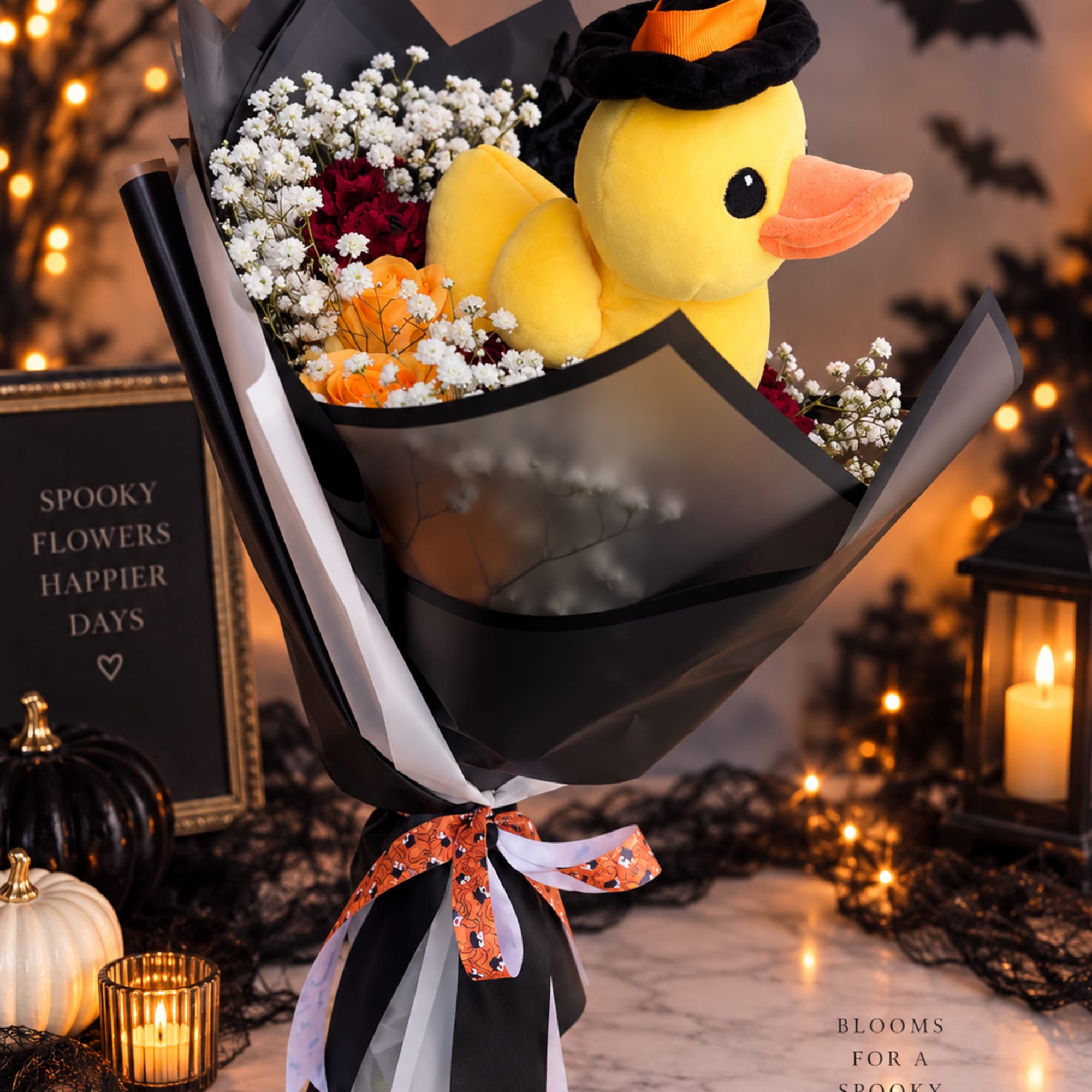 Halloween bouquet with a plush duck and mixed flowers wrapped in black paper