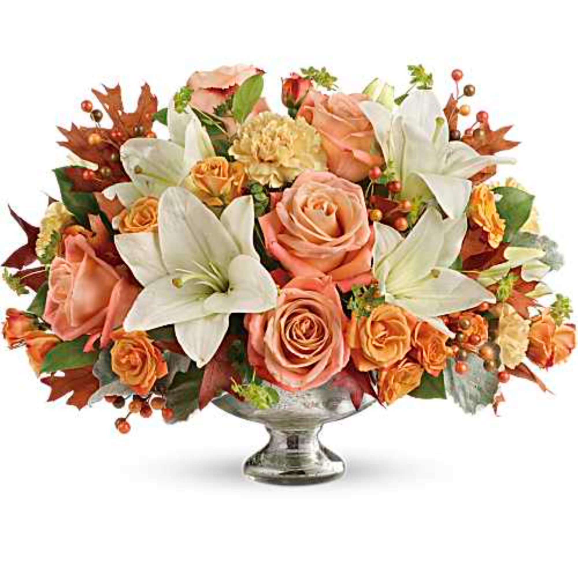 Peach roses and white lilies arranged in a glass vase