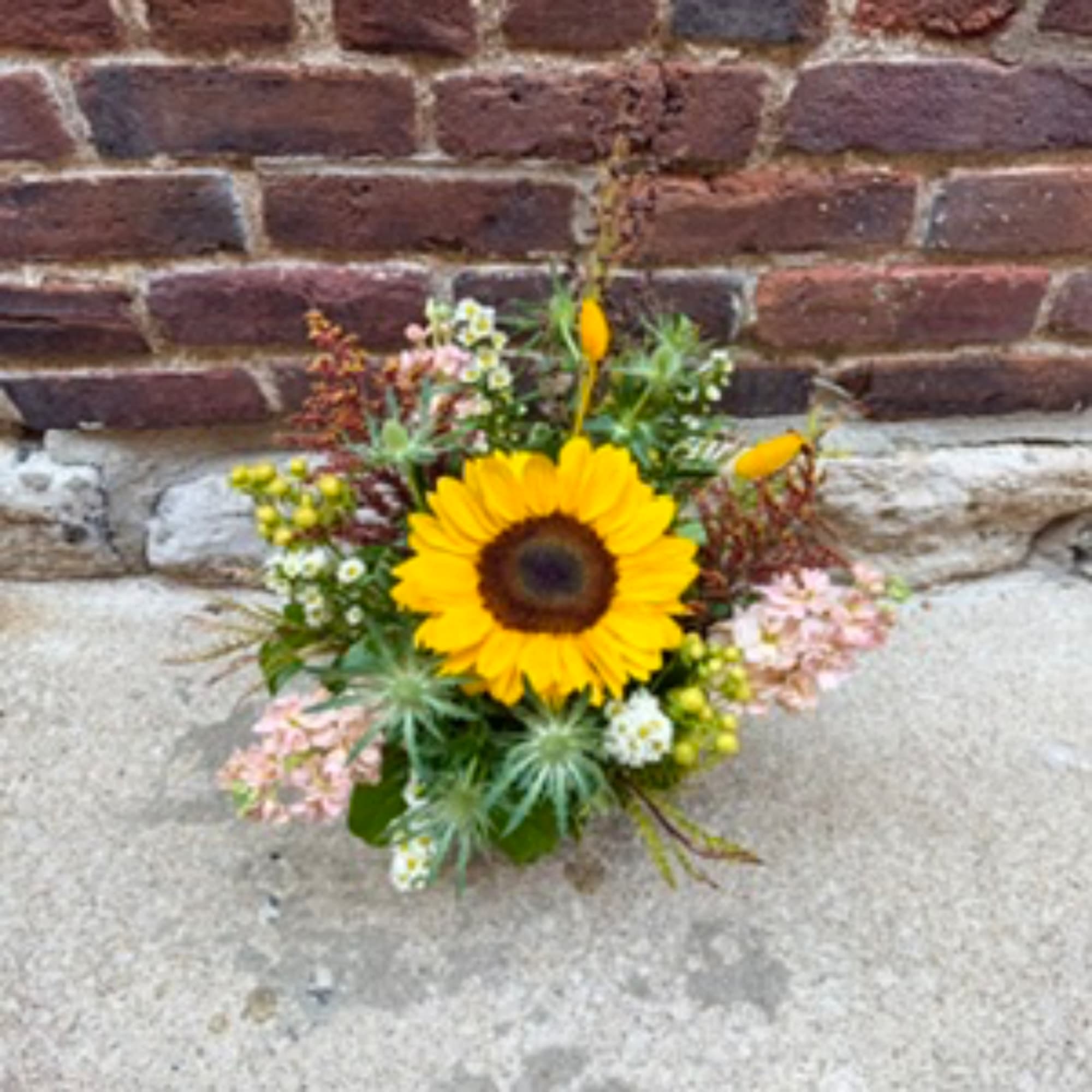 Sunflower bouquet with small pink and white flowers