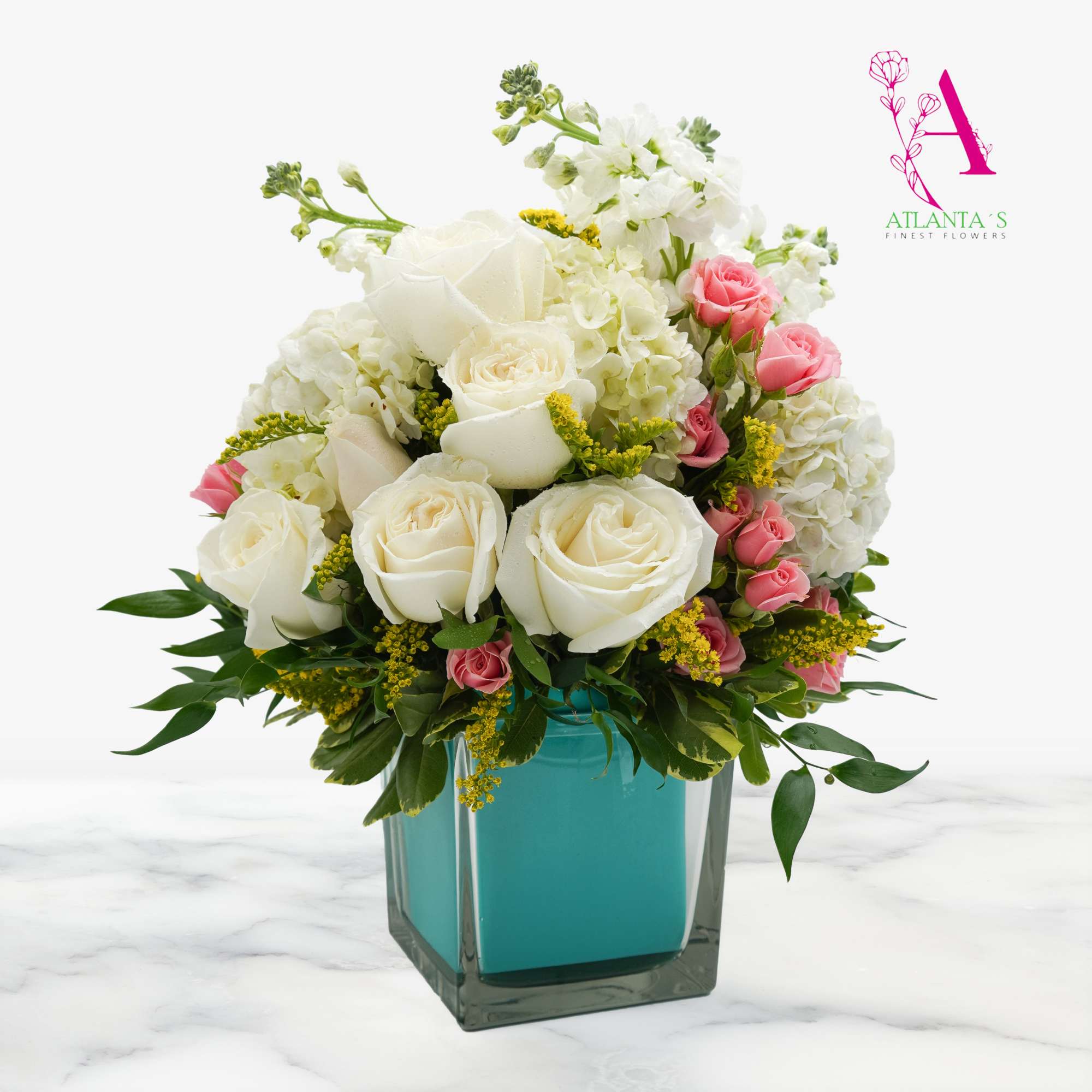 White and pink rose bouquet in a turquoise vase