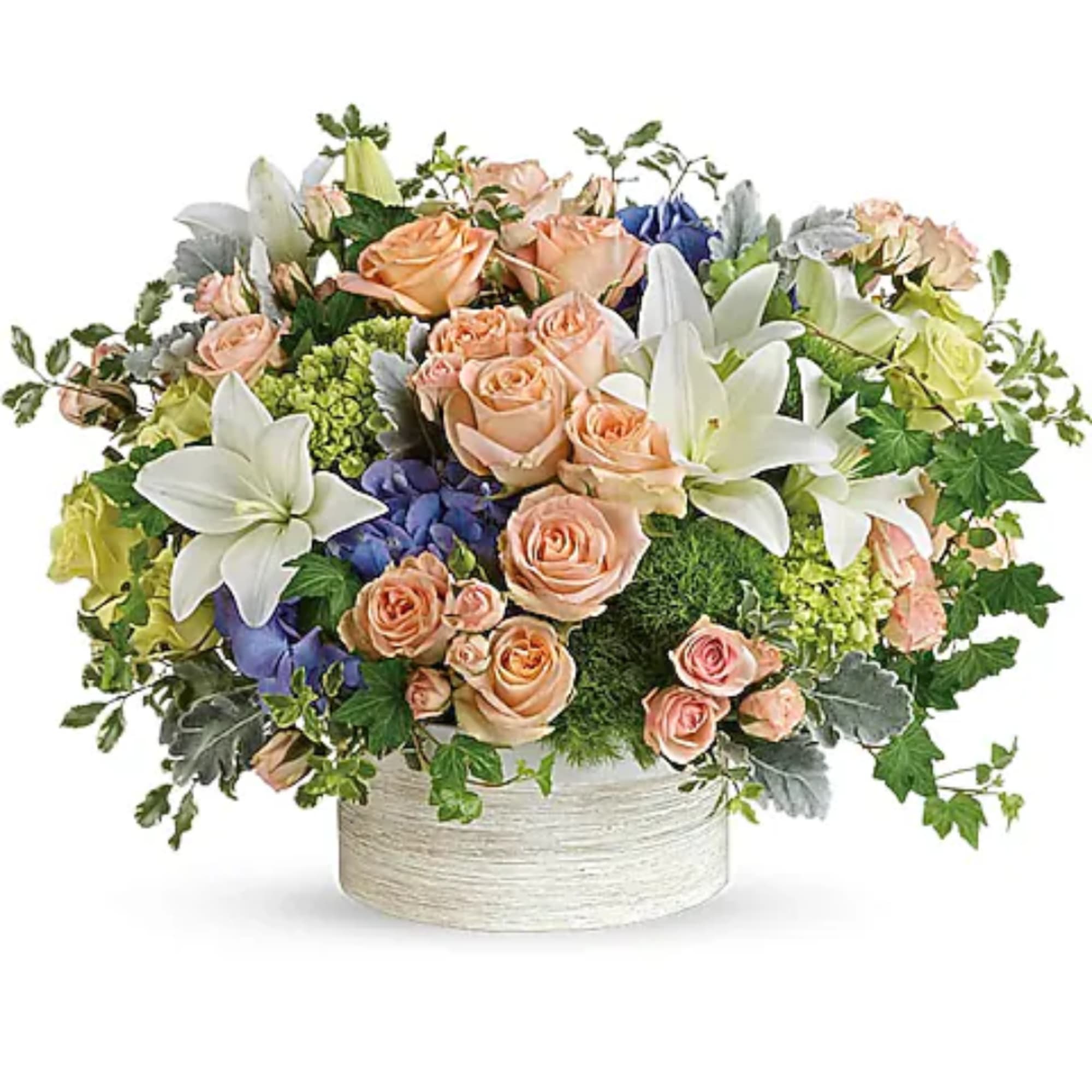 Peach roses and white lilies arranged in a round white container