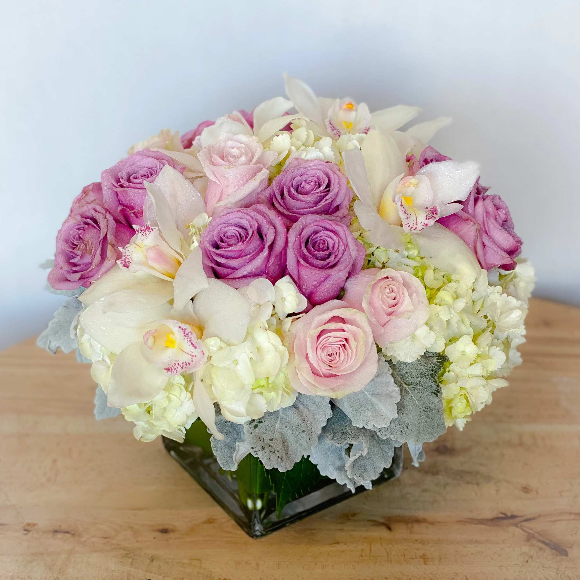 Classic and Beautiful, this large arrangement whispers luxury. Soft pinks, whites and