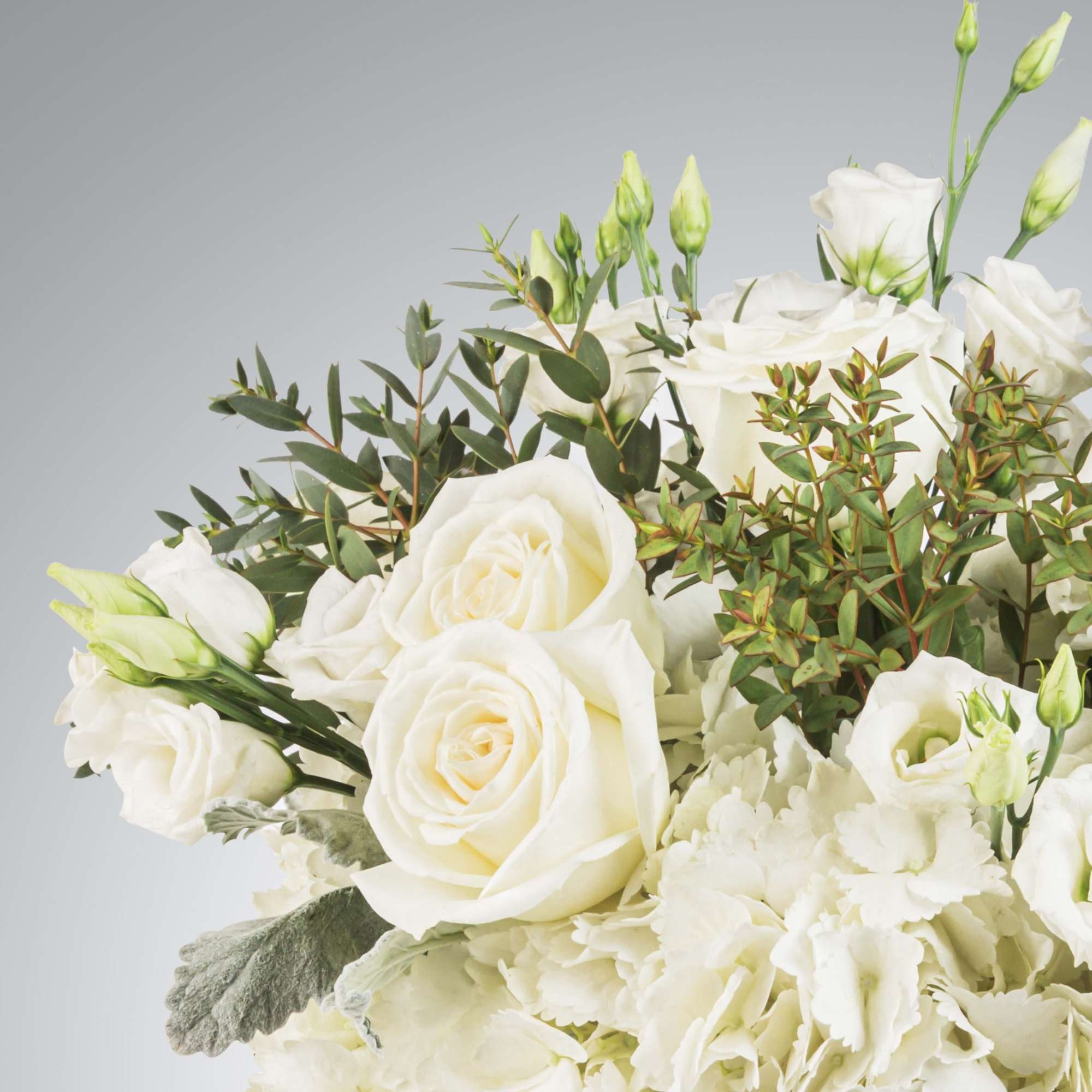 New beginnings deserve flowers! This all white arrangement includes roses, lisianthus and, photo 2 of 2