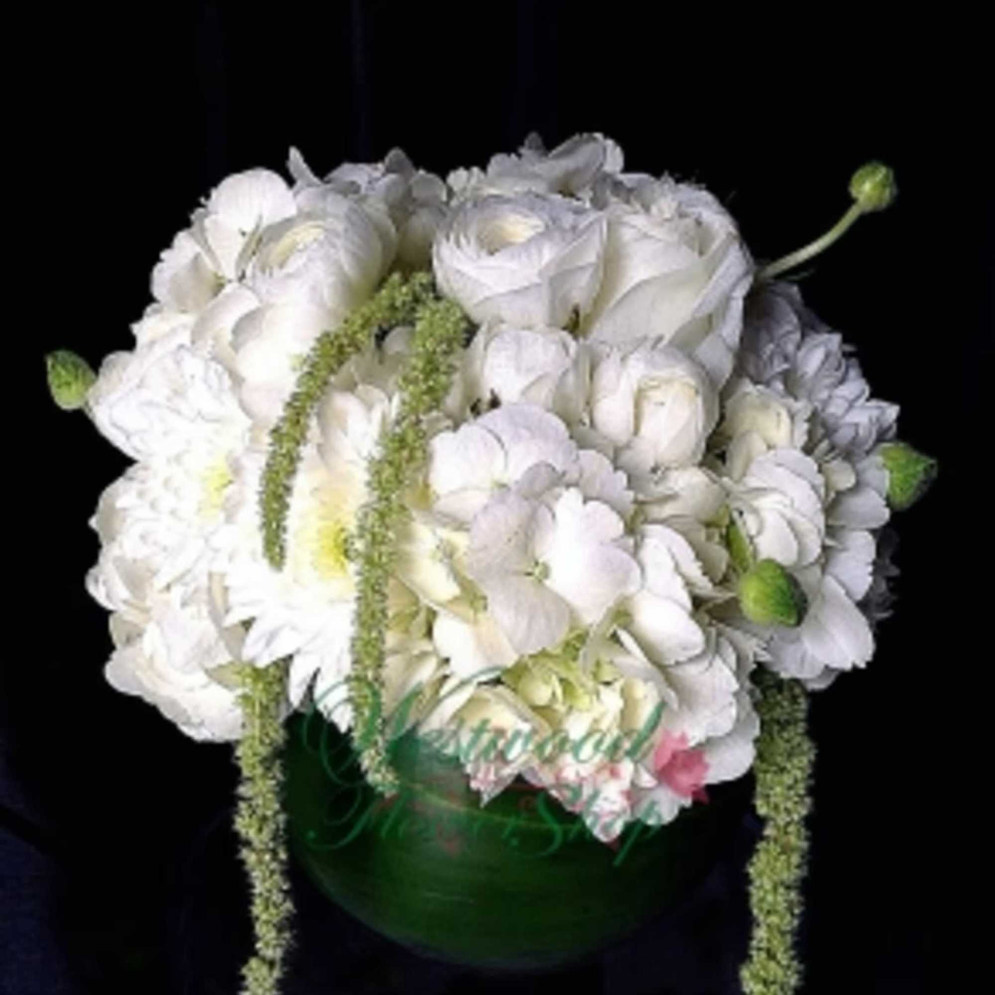Pure white perfection! A centerpiece bouquet suited for all occasions. Designed with