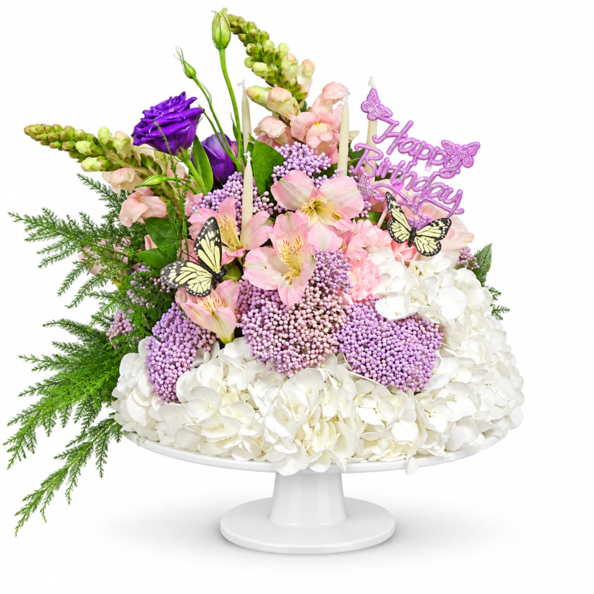 Pink and white floral arrangement on a pedestal stand with a birthday topper