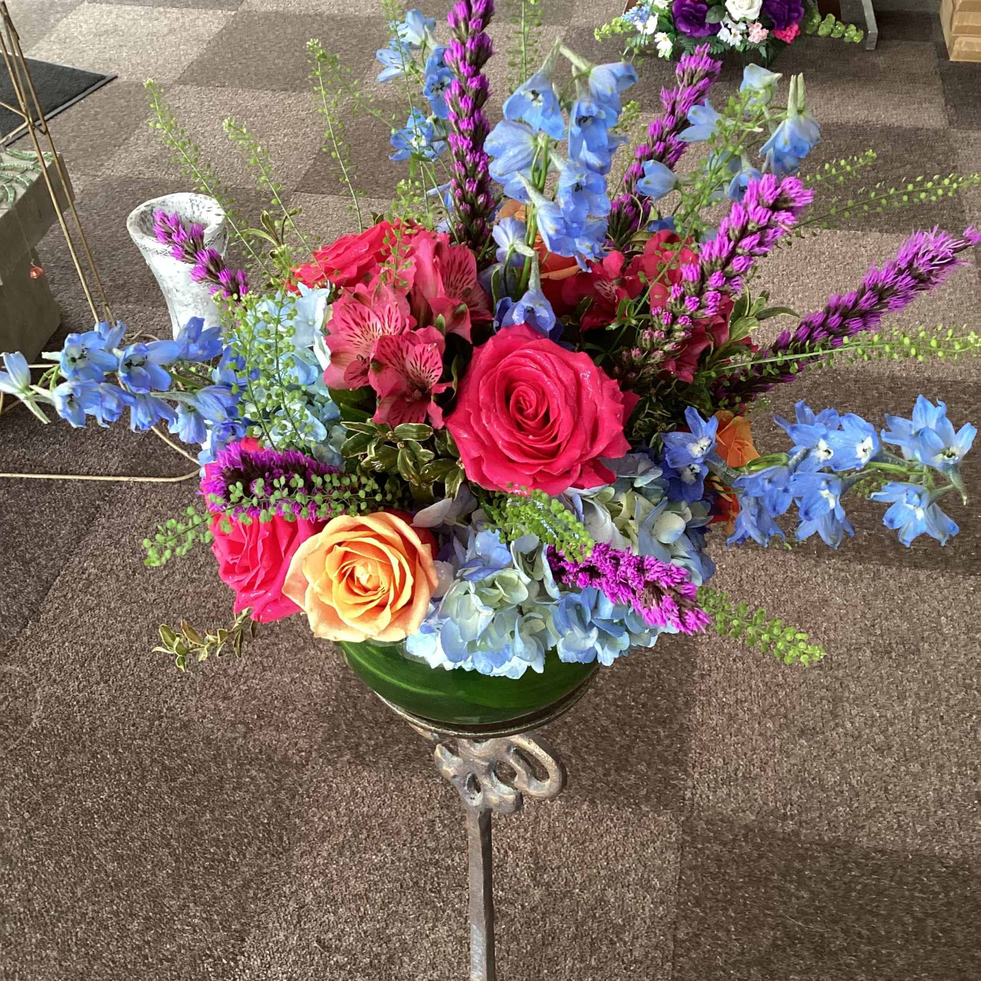 Stunning mix of pale blue hydrangeas, sky blue delphinium, hot pink and, photo 2 of 3