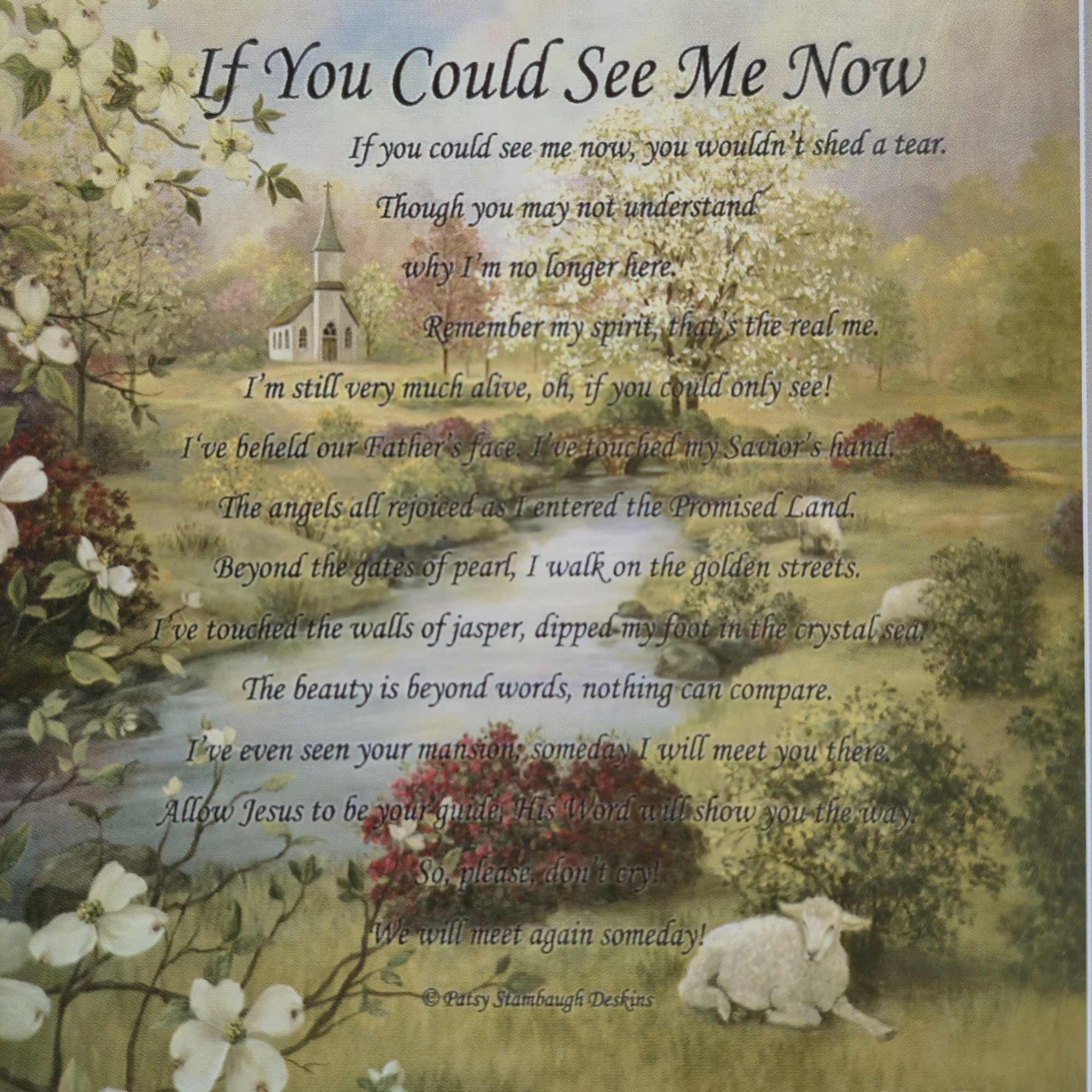 Memorial plaque with a pastoral scene, white flowers, and a poem about seeing someone again.