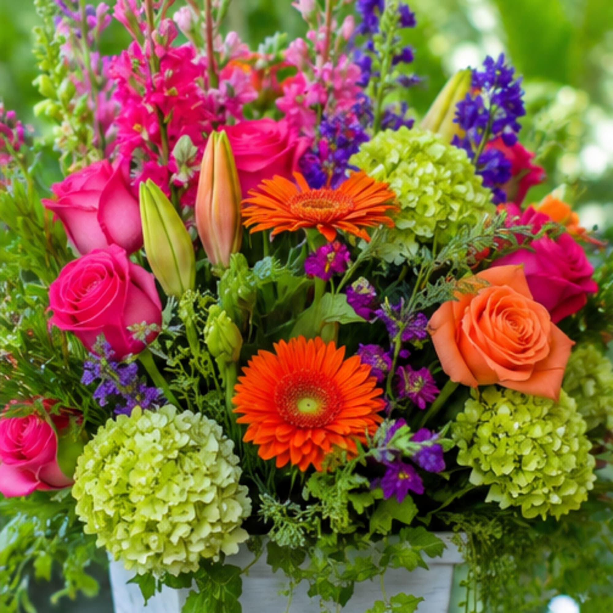 Bright pink roses and vibrant orange gerbera daisies pop against lime-green hydrangeas