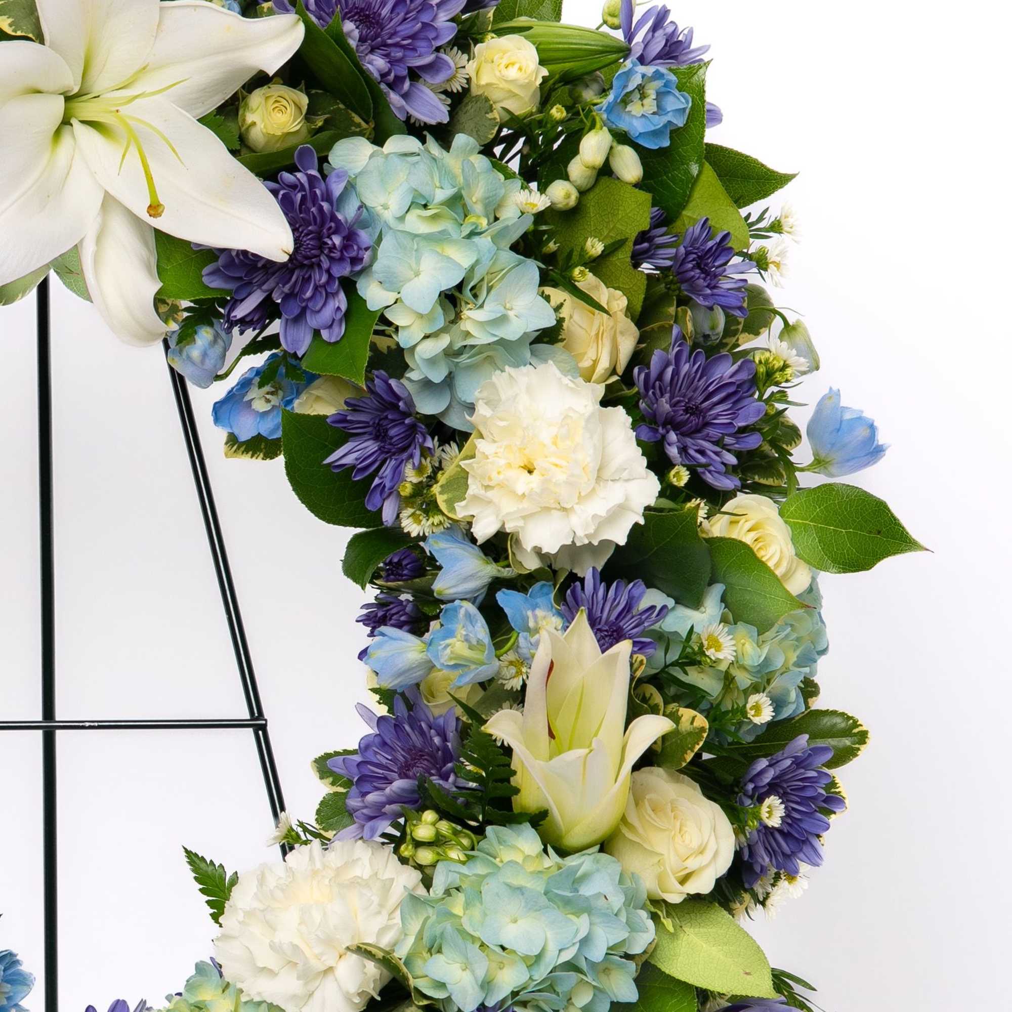 A classic circular tribute symbolizing eternal life and remembrance, this wreath is, photo 2 of 2
