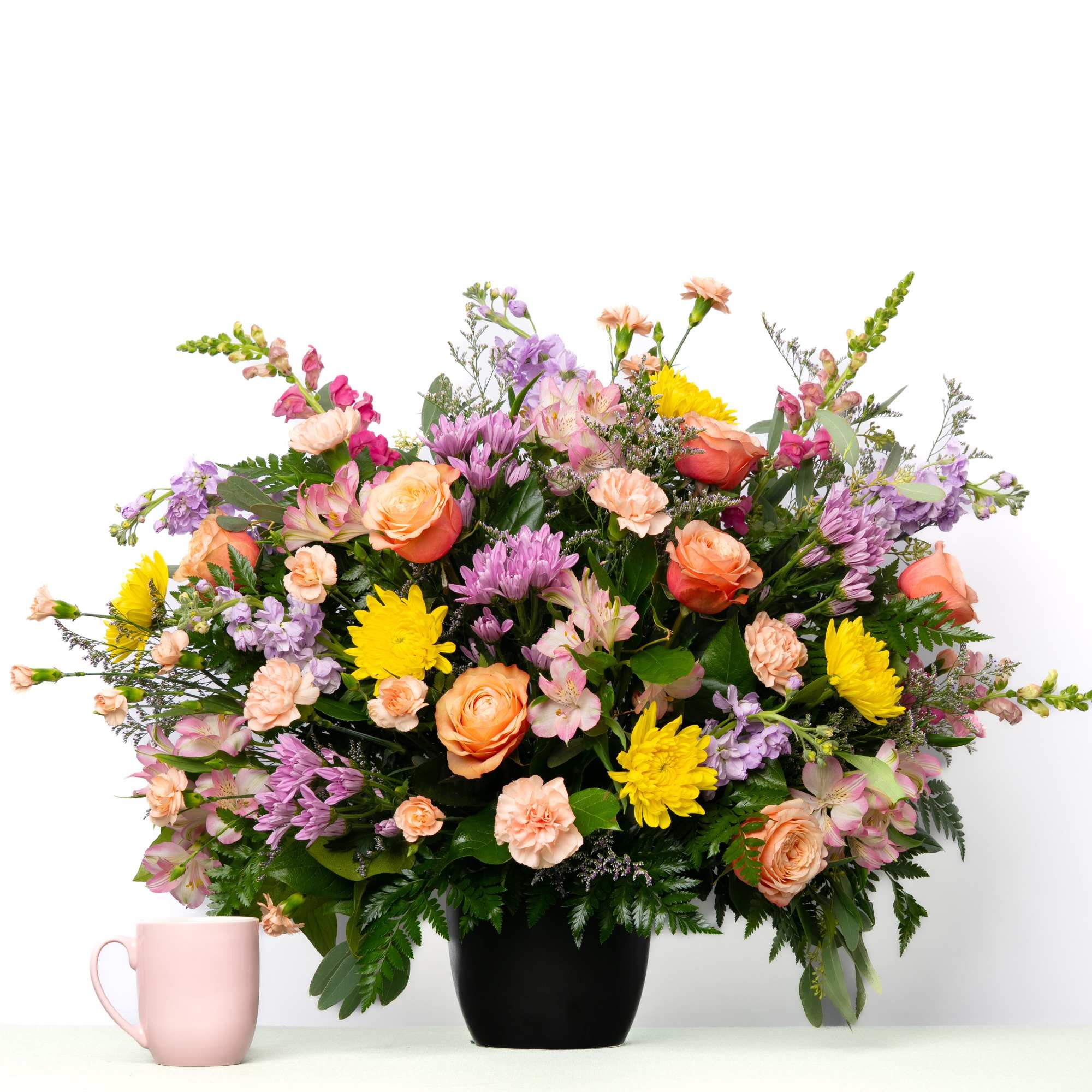 Soft pastel blooms create a gentle and comforting tribute, offering a sense, photo 2 of 3
